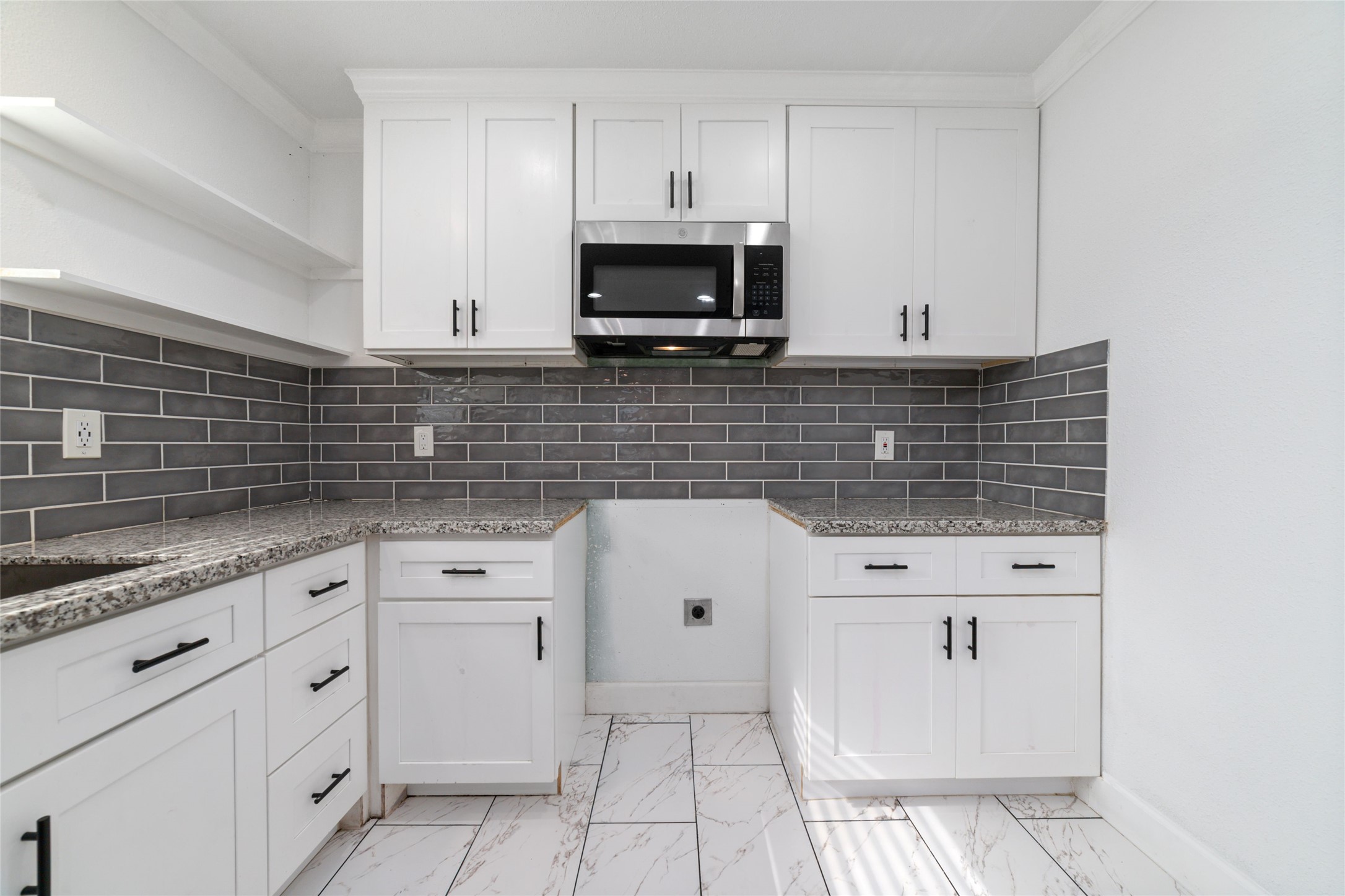 A brand new GE stove and electric cooktop has been purchased for this beautiful kitchen.