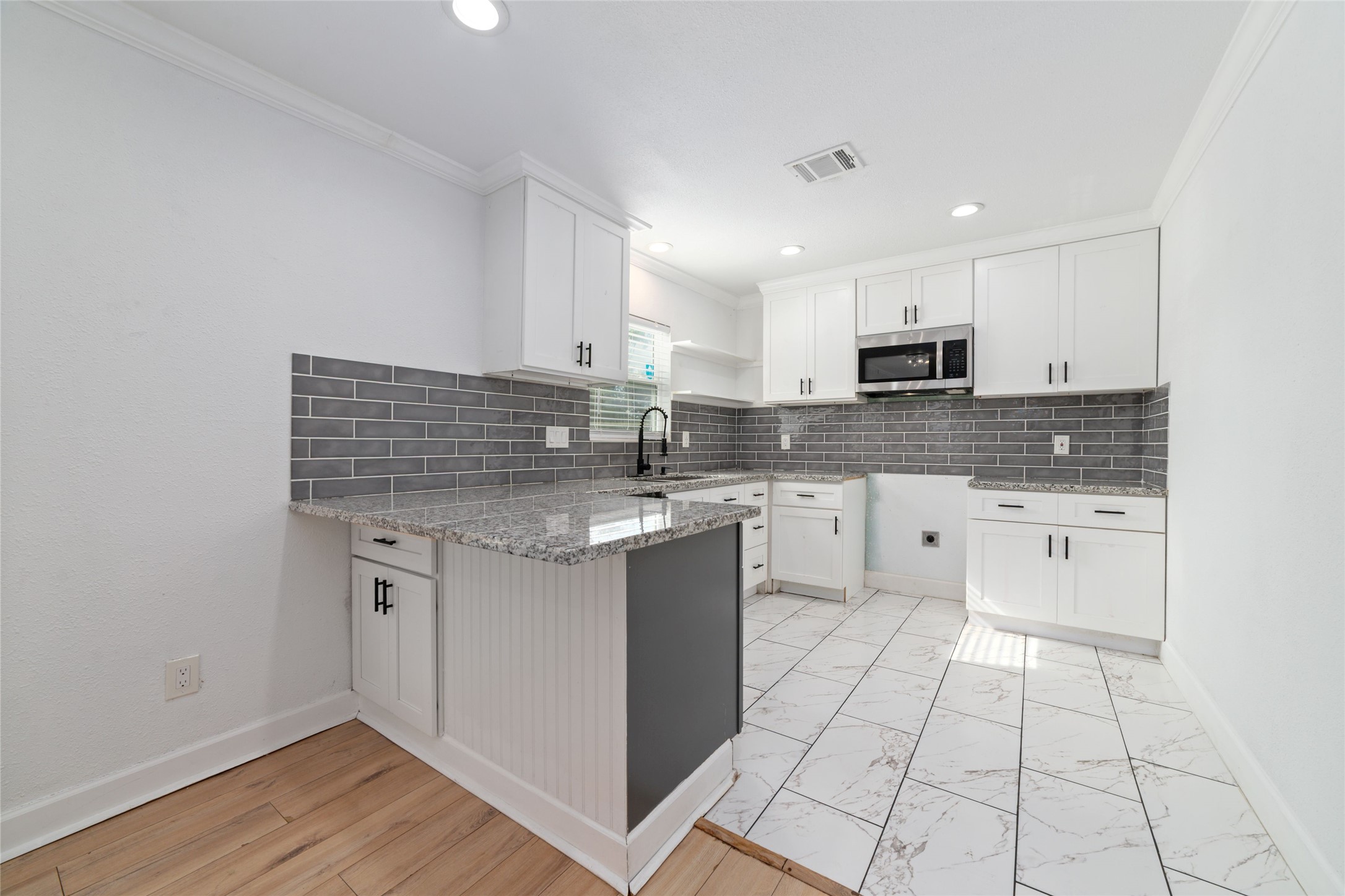 Welcome inside your beautifully updated kitchen with a neutral, timeless color palette. A new stove has been placed in this kitchen.
