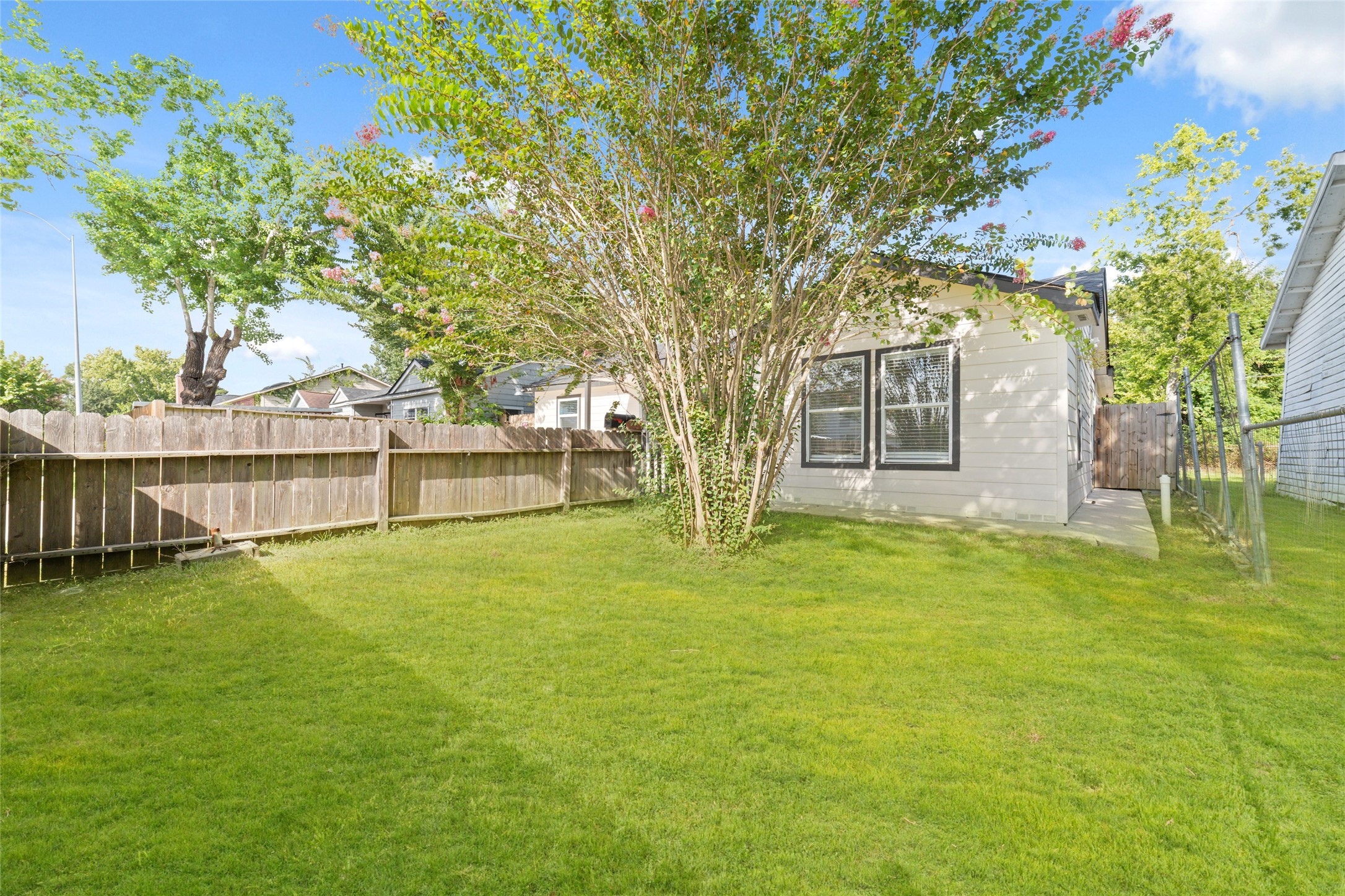 Large grassy backyard behind the two dwellings. Welcome home to 7125 Conley. This adorable home is move-in ready now.