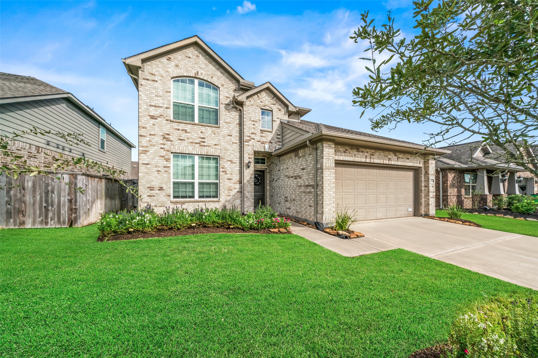 Stunning two-story brick home with a spacious two-car garage, manicured lawn, and charming landscaping, offering great curb appeal in a welcoming neighborhood. Stunning two-story brick home with a spacious two-car garage, manicured lawn, and charming landscaping, offering great curb appeal in a welcoming neighborhood.
