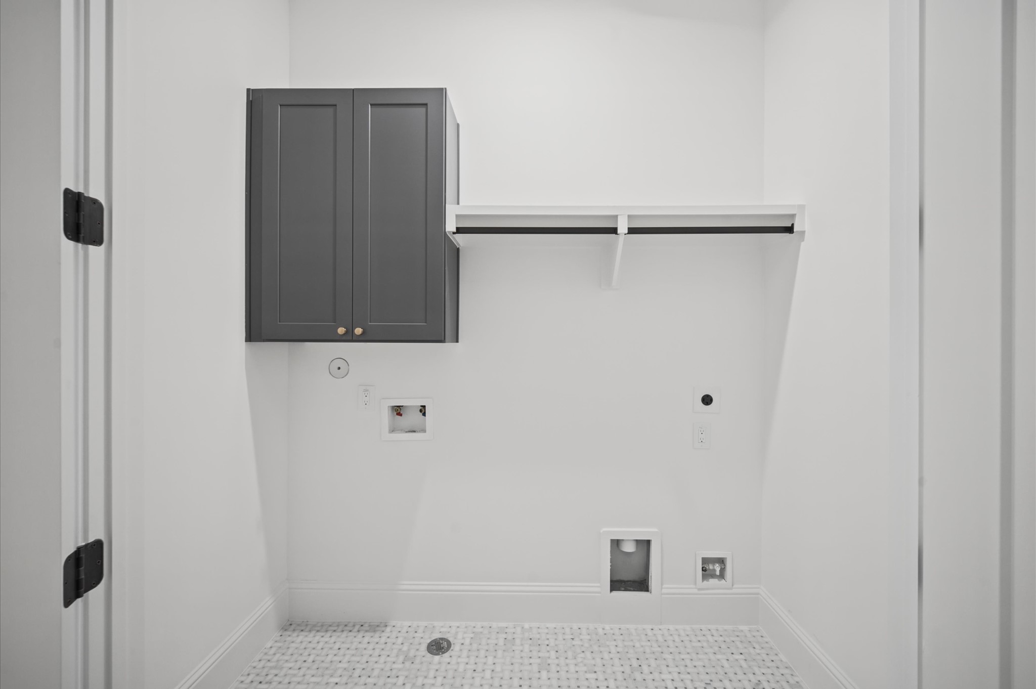 Centrally-located laundry room with convenient access from all bedrooms.