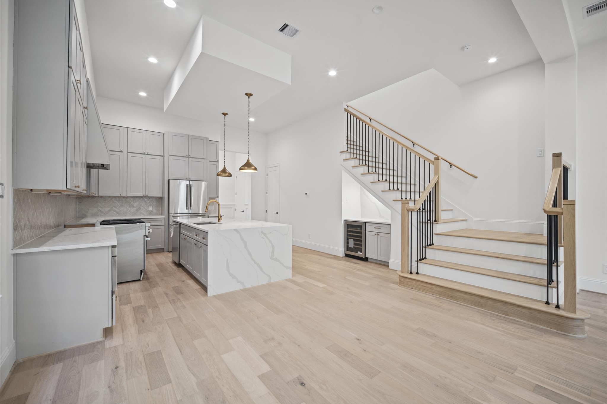 Open-concept layout offers a seamless transition from the living area to the kitchen.