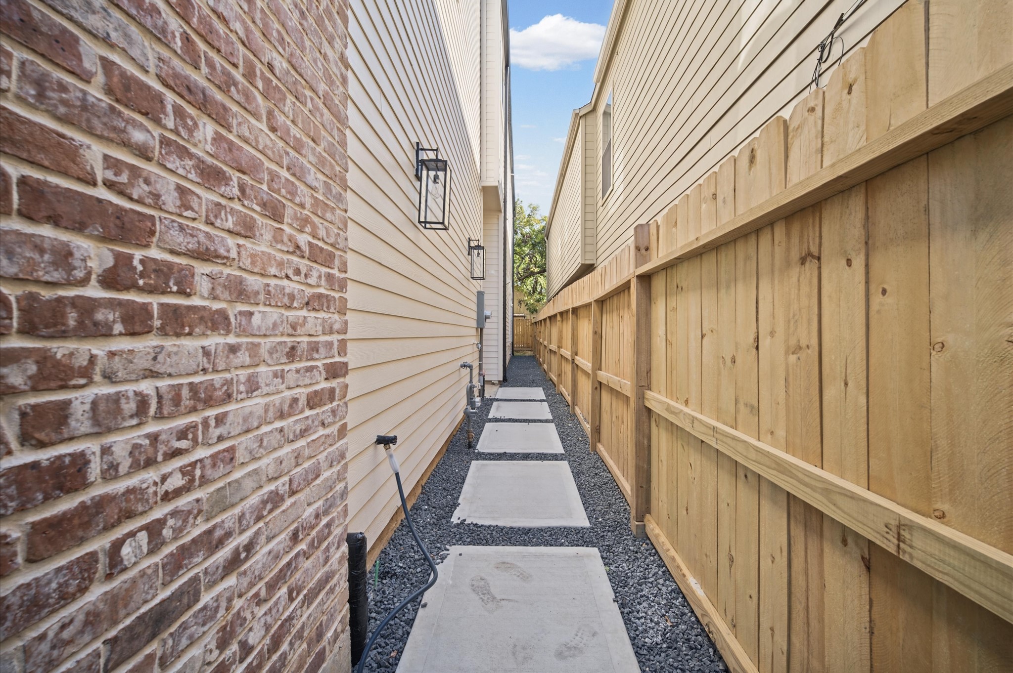 Private Gated entrance with access to the backyard.