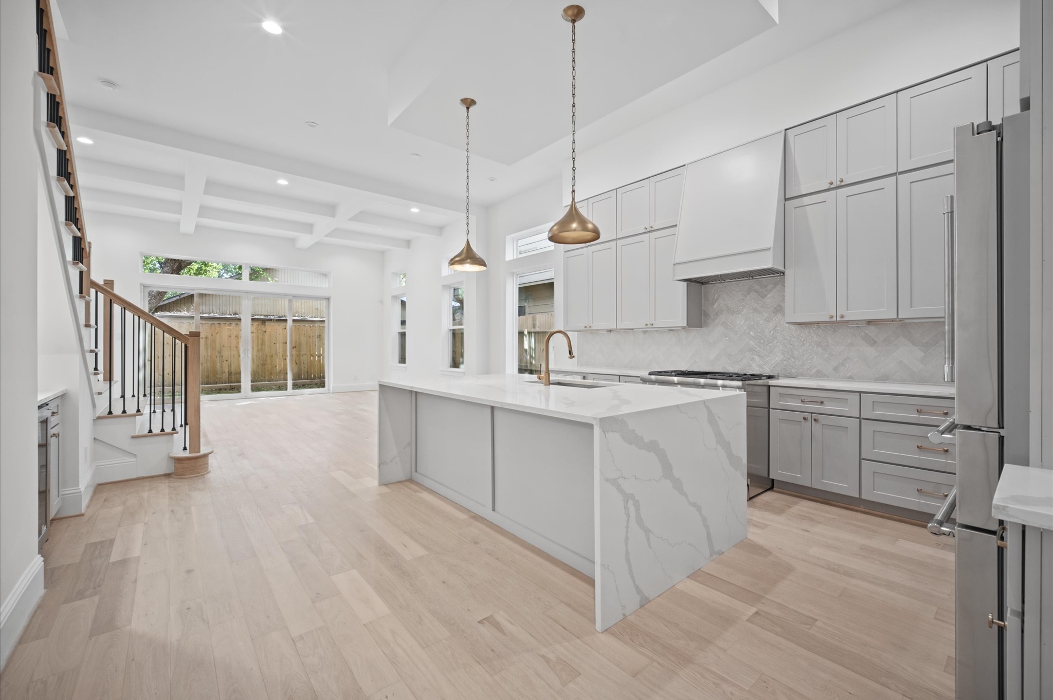 Kitchen overlooks the dining and living areas, creating an ideal space for everyday living and entertaining.