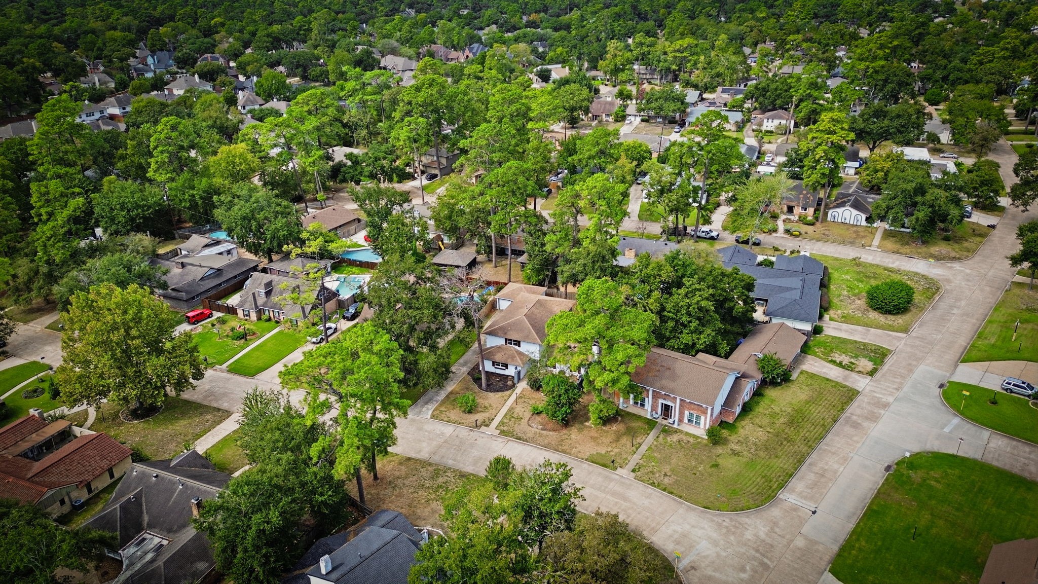 Pleasant neighborhood with tree-lined streets, spacious yards, and a mix of traditional and modern homes, perfect for family living.