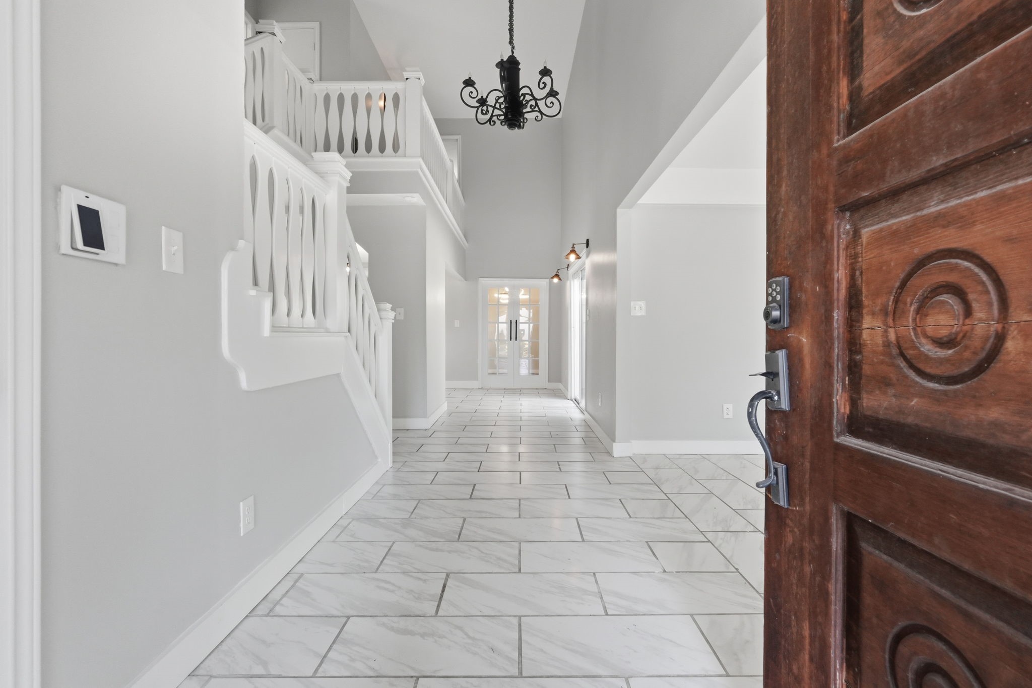 This grand entry welcomes you into a bright and spacious area.