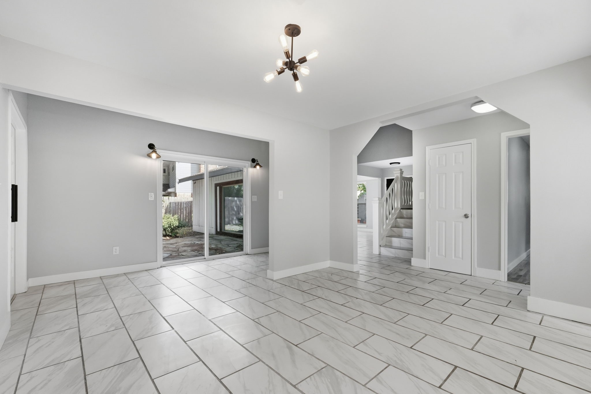 This dining area offers convenient access to the patio with large sliding glass doors.