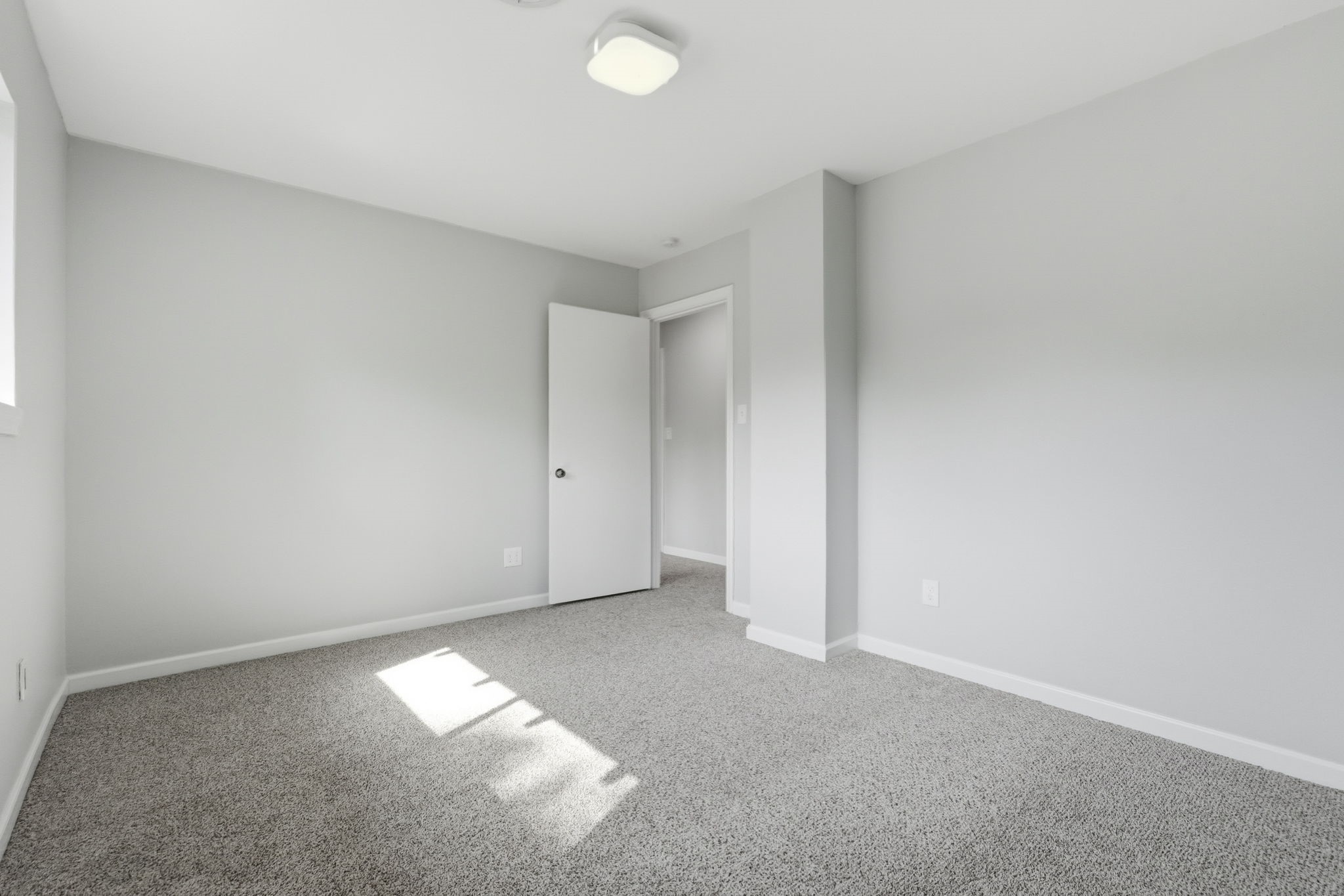 This bedroom is bright and inviting, perfect for a cozy space.