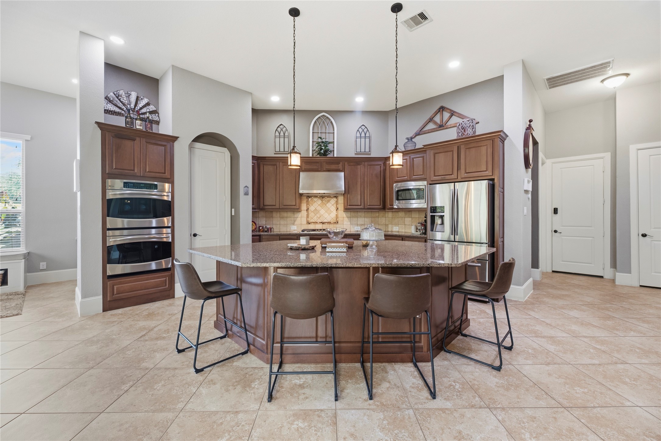 Premium cabinetry, stainless steel appliances, gas cooktop, double ovens, and more.