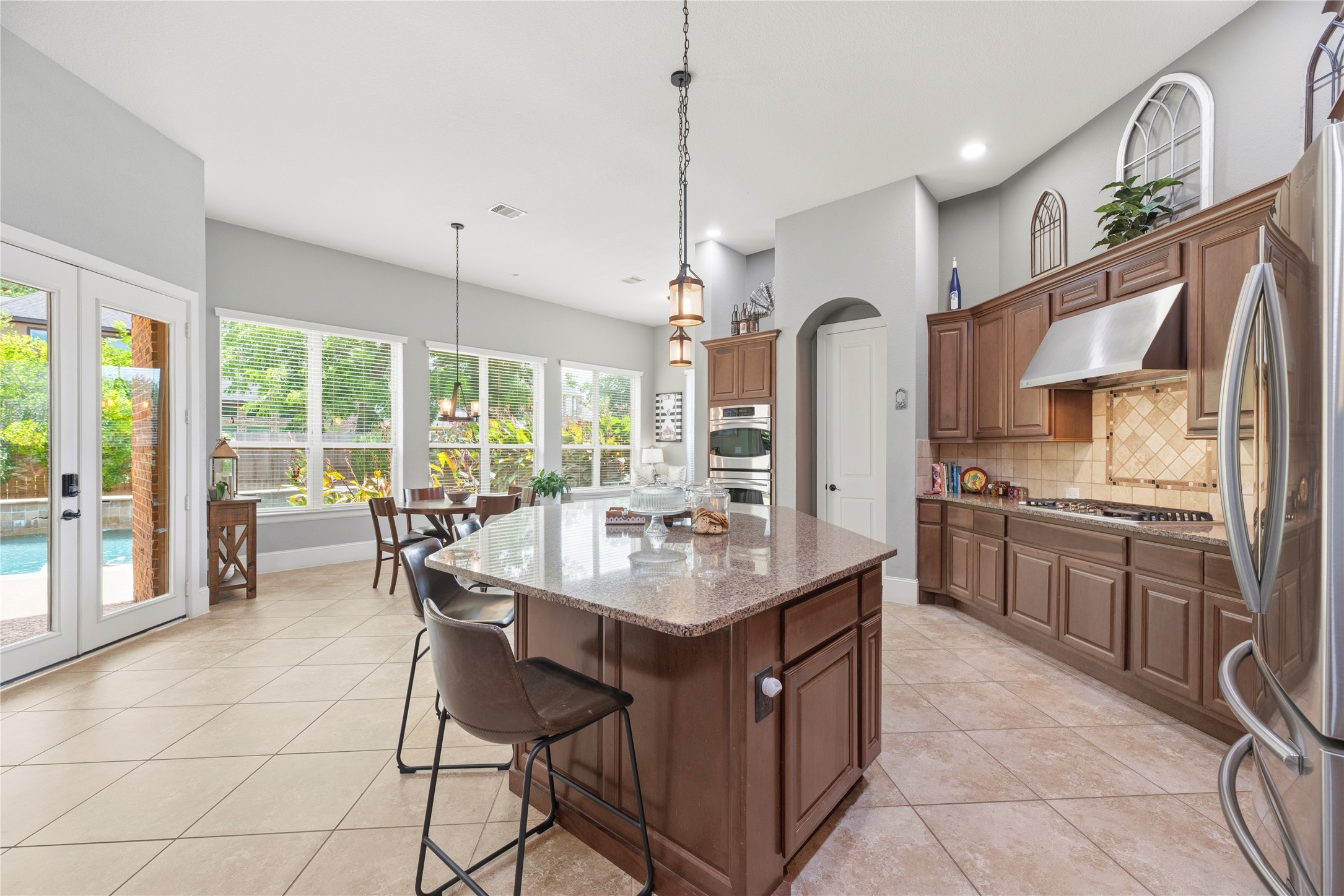 Premium cabinetry, stainless steel appliances, gas cooktop, double ovens, and more.