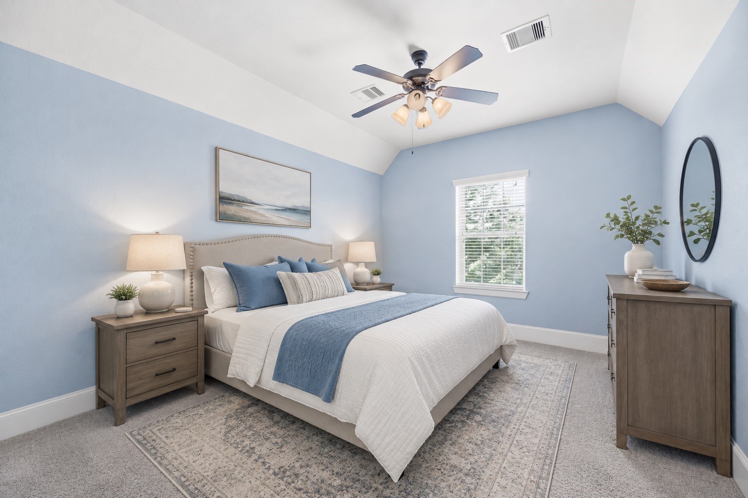 *virtually staged* Generously sized secondary bedroom suite with plush carpet, ceiling fan and walk-in closet.