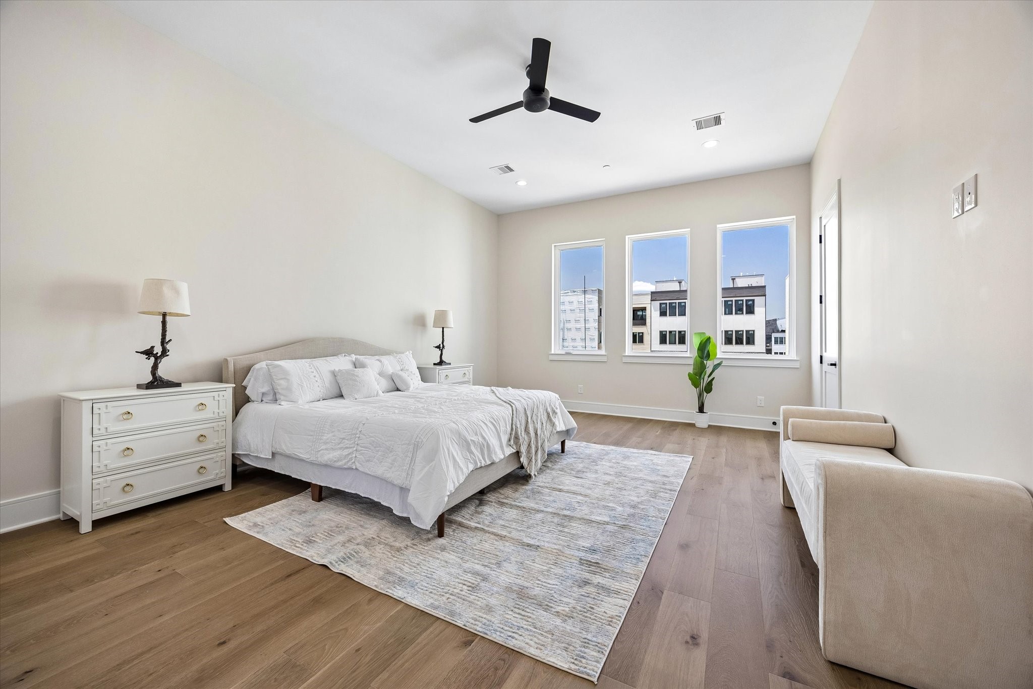 Lots of natural light and a sitting area in the Primary Suite