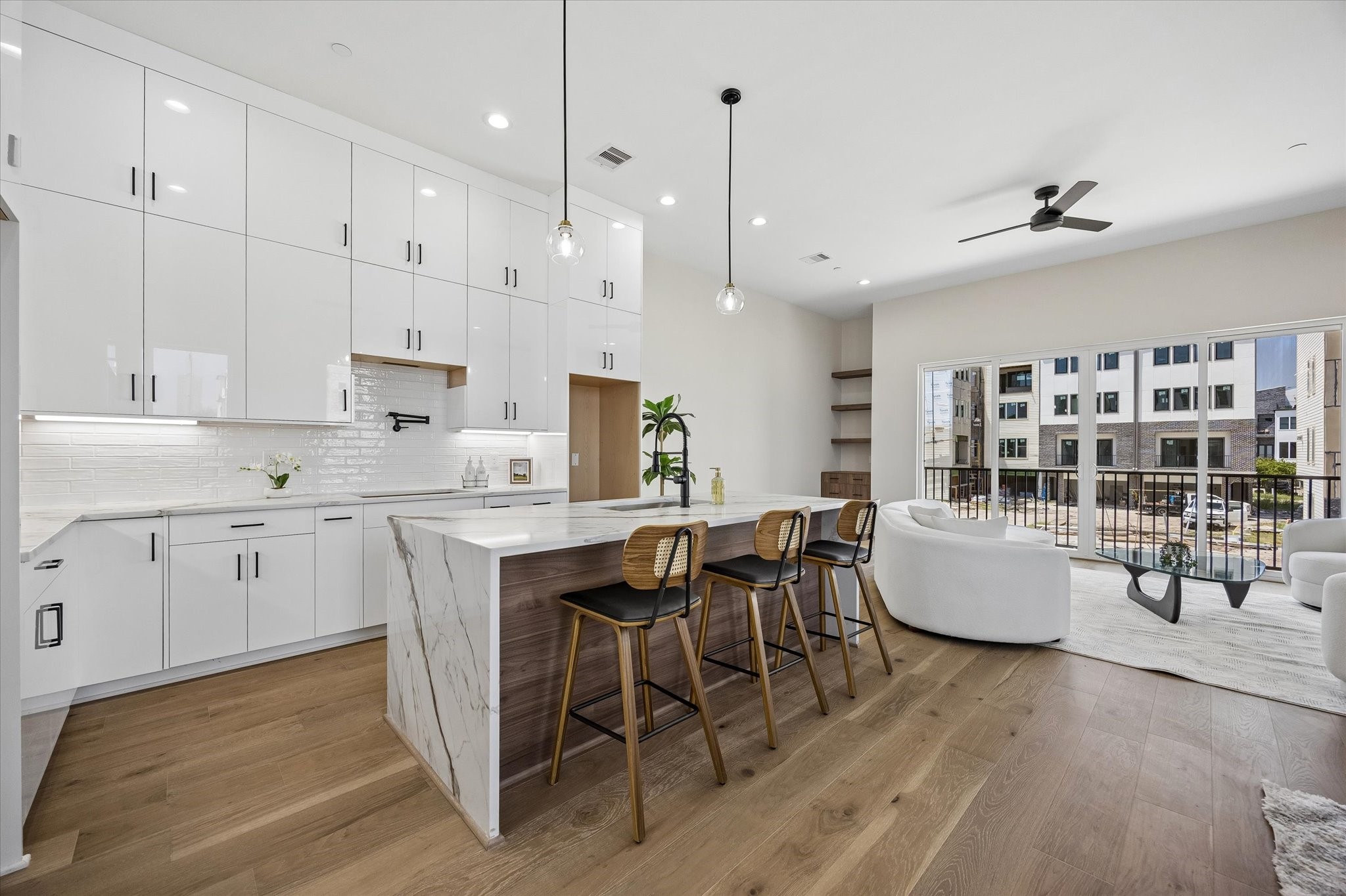 Standout features include a waterfall island, double stack cabinetry and a pot filler