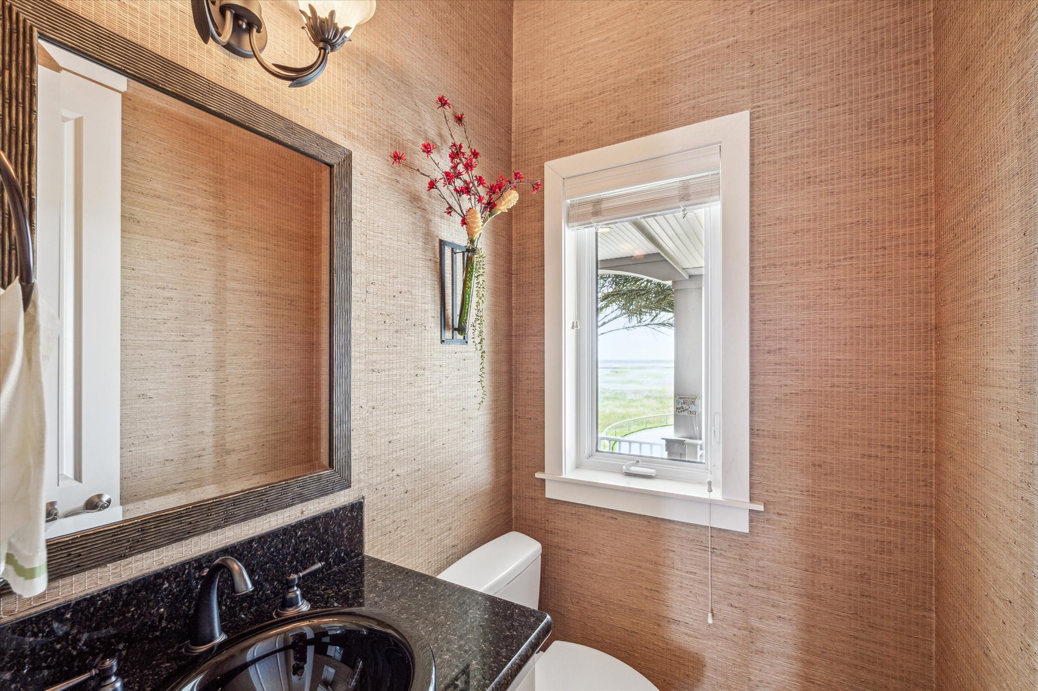 A half bath is conveniently located next to the elevator on the main level