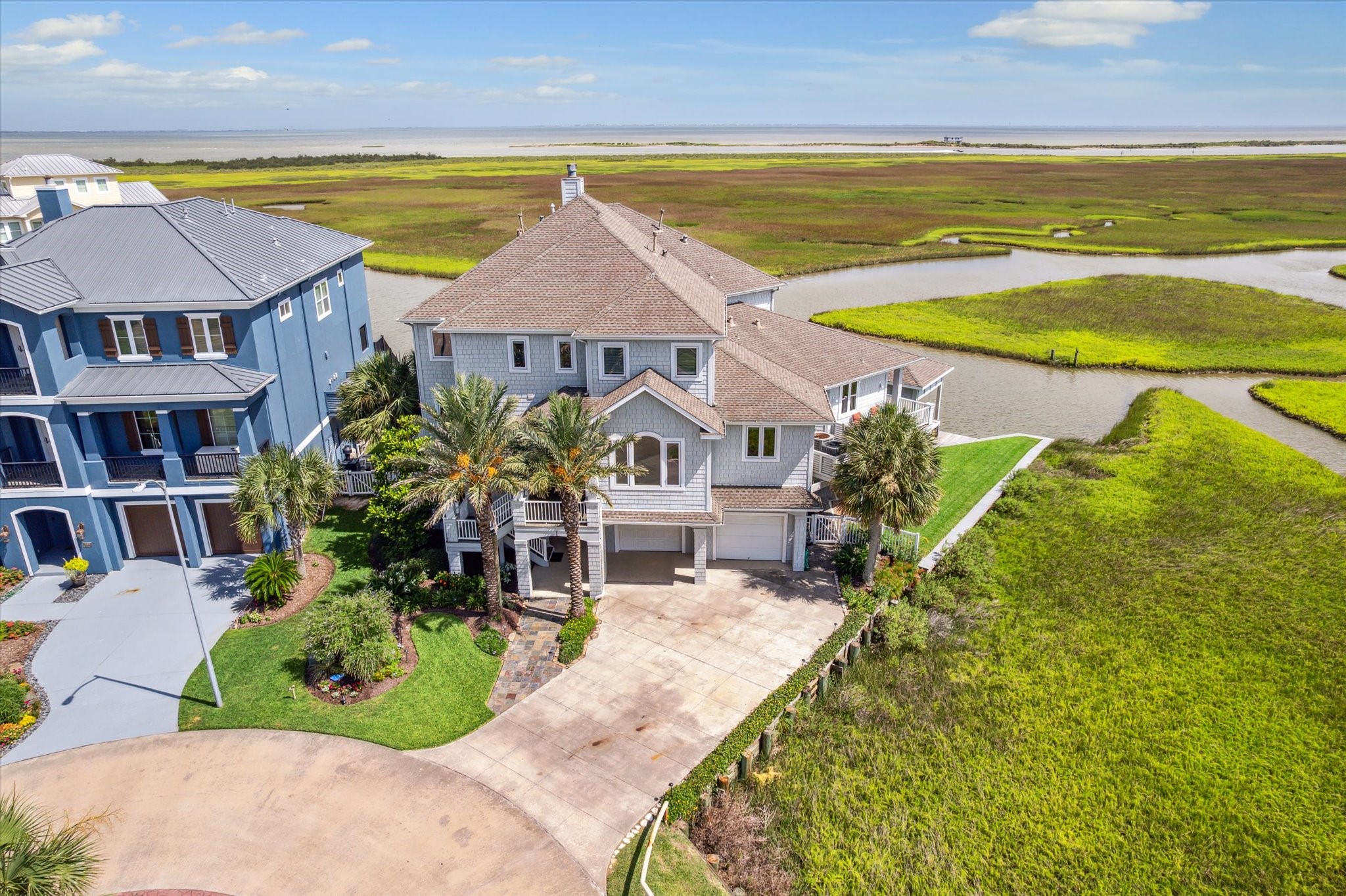 A true boaters paradise, this unique property features a private dock and ample space for waterfront enjoyment, while the wraparound shoreline creates the ultimate setting for relaxed coastal living or entertaining