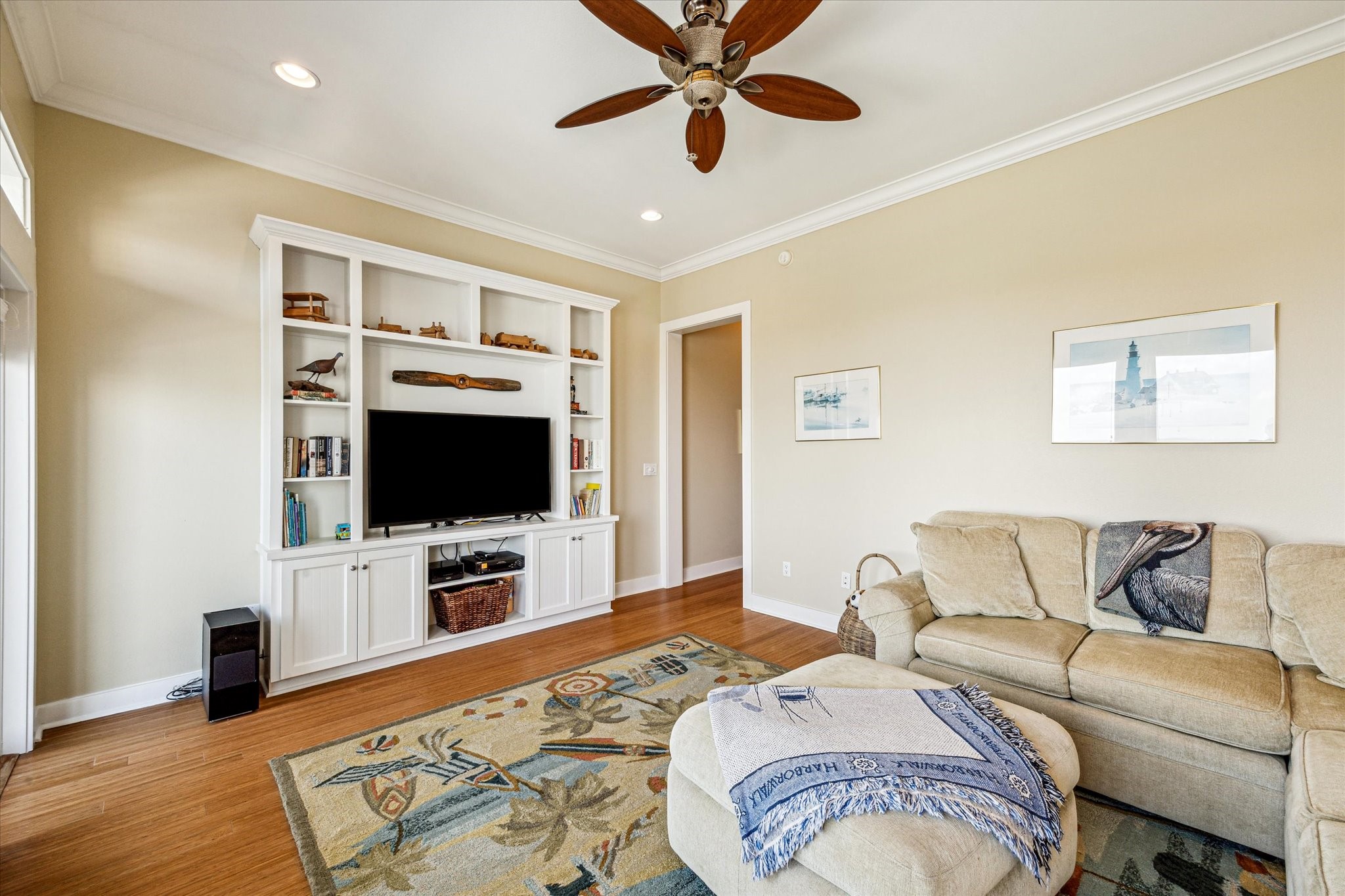 A secondary view of the flex space showcases the custom built-ins that anchor the room with both style and function
