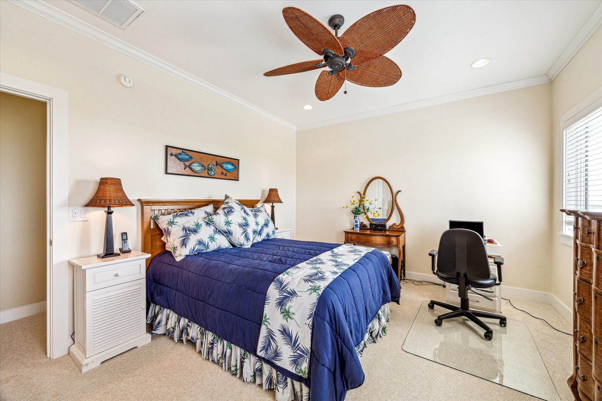 An additional guest room features its own private full bath for added comfort and convenience