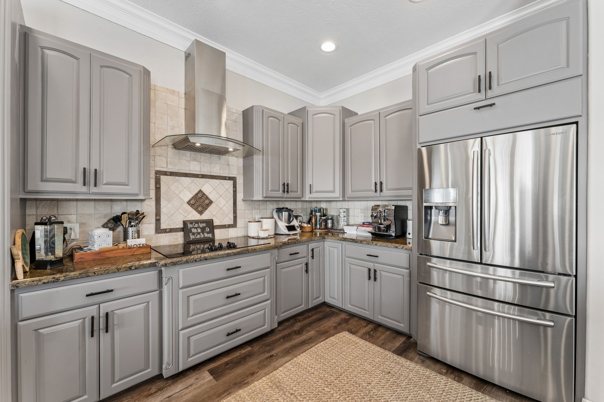 Beautifully appointed kitchen featuring custom cabinetry, granite countertops, and stainless steel appliances. Thoughtful storage and elegant finishes combine style with everyday functionality. Beautifully appointed kitchen featuring custom cabinetry, granite countertops, and stainless steel appliances. Thoughtful storage and elegant finishes combine style with everyday functionality.