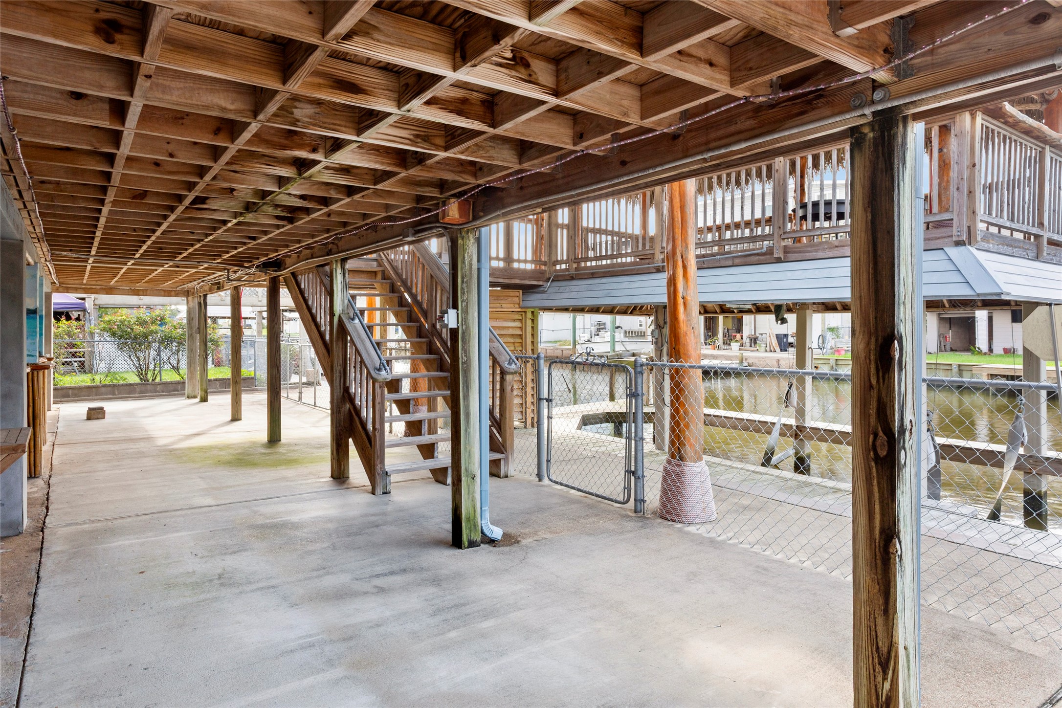 Enjoy serene waterfront views from your spacious, covered ground-level deck.