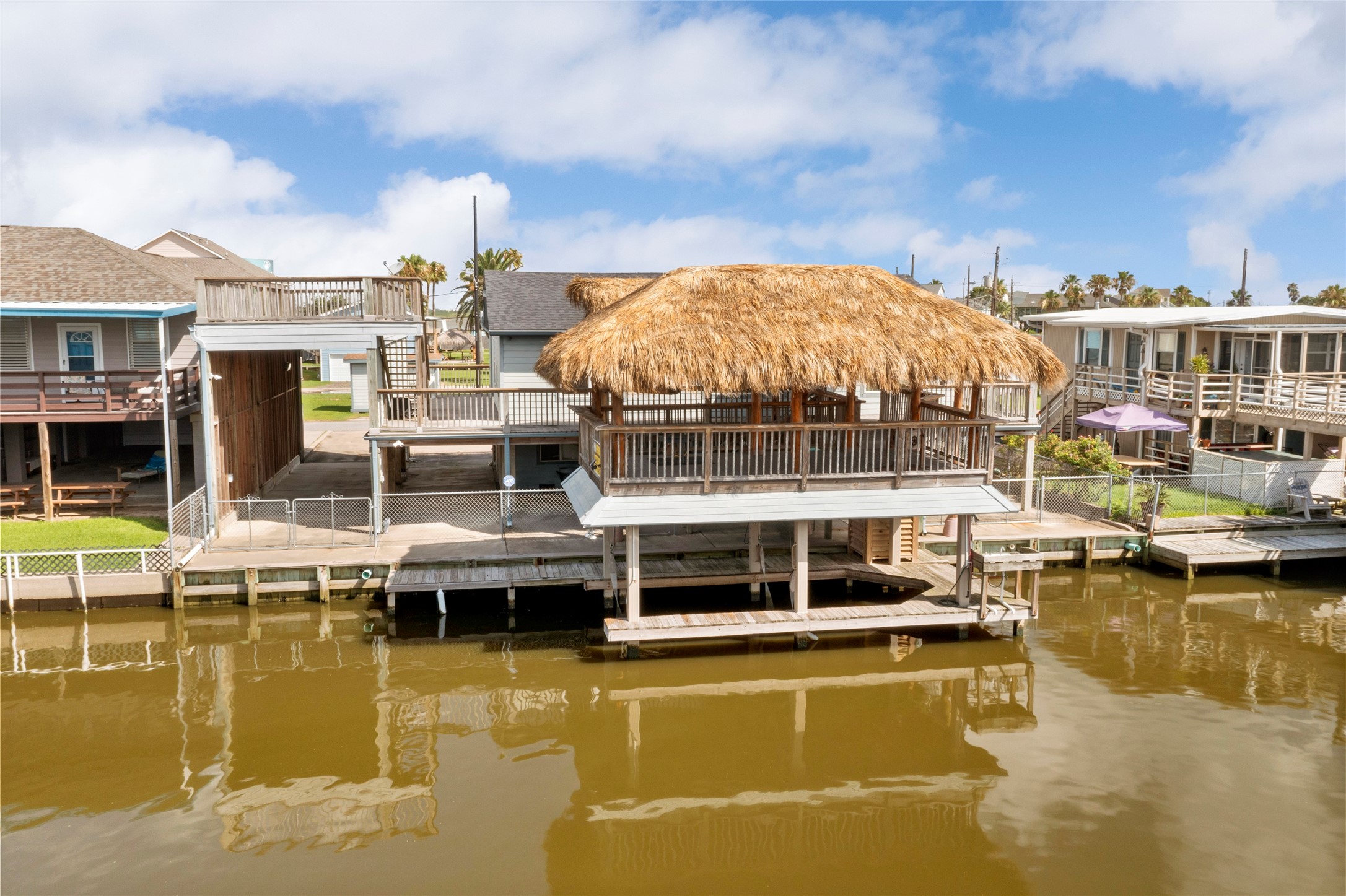 Waterfront paradise with a spacious palapa bar and convenient boat liftideal for relaxation and boating enthusiasts!