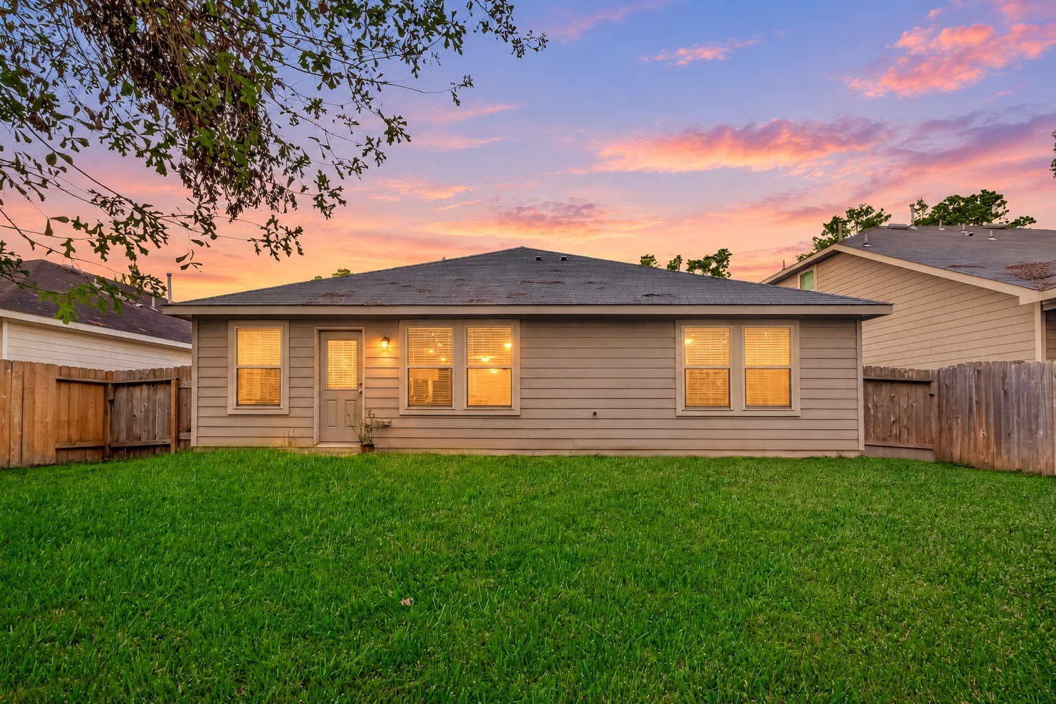 Spacious backyard offering plenty of room for outdoor fun, family gatherings, and entertaining, with endless possibilities for creating your ideal outdoor retreat.