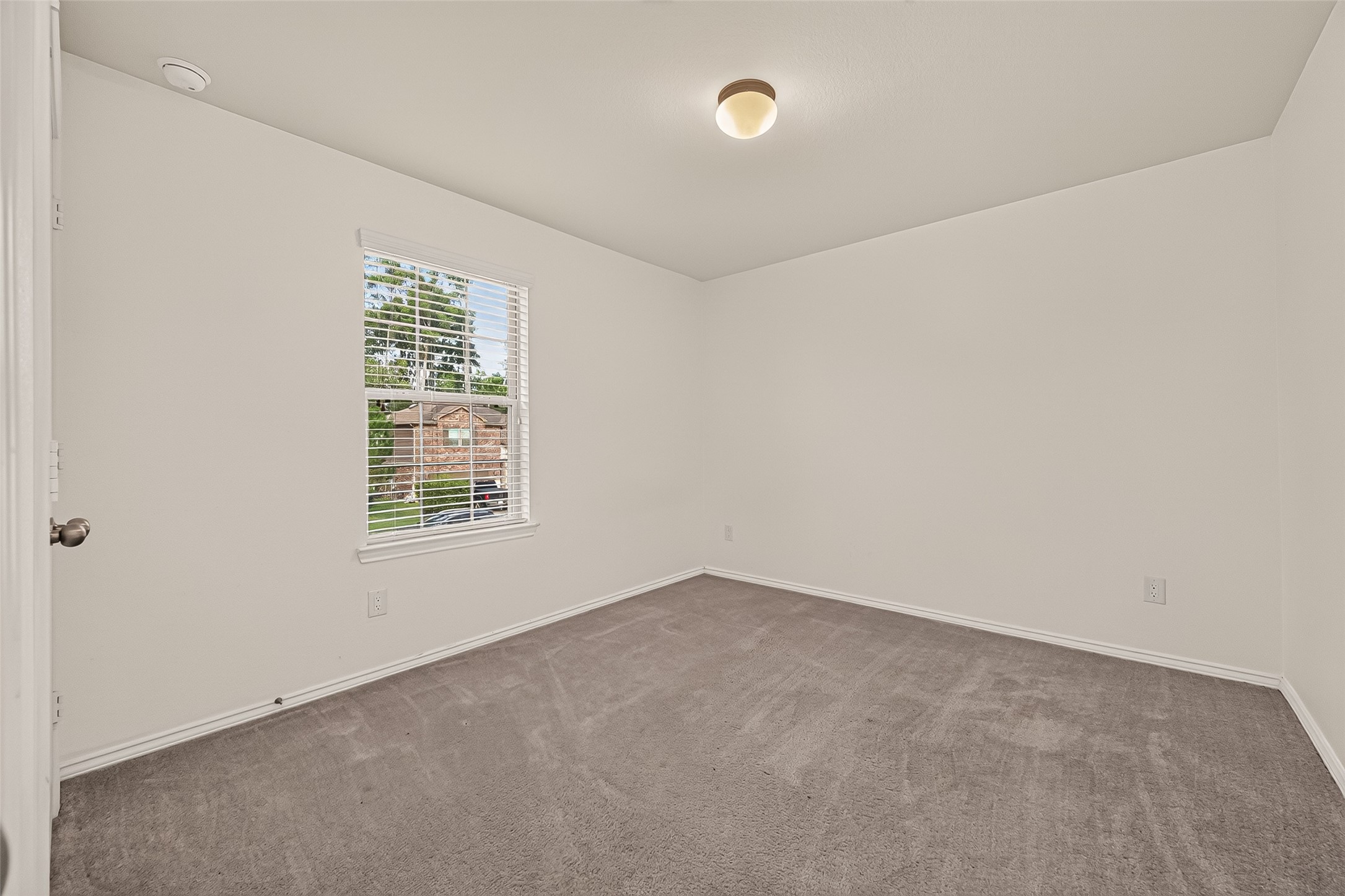 Second-floor Secondary Bedroom #4 offers a comfortable and versatile space with a welcoming atmosphere, ideal for relaxation