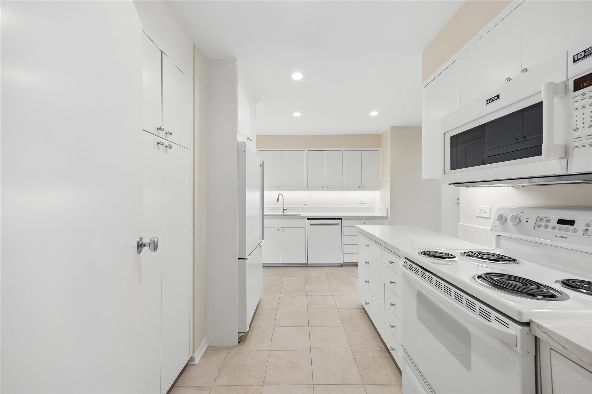 Kitchen with new granite countertops and custom cabinetry
