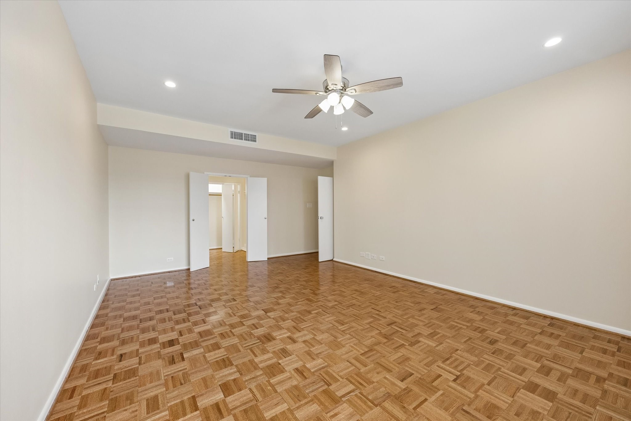 Large Master Bedroom (15.5 x 21.1) with parkay flooring