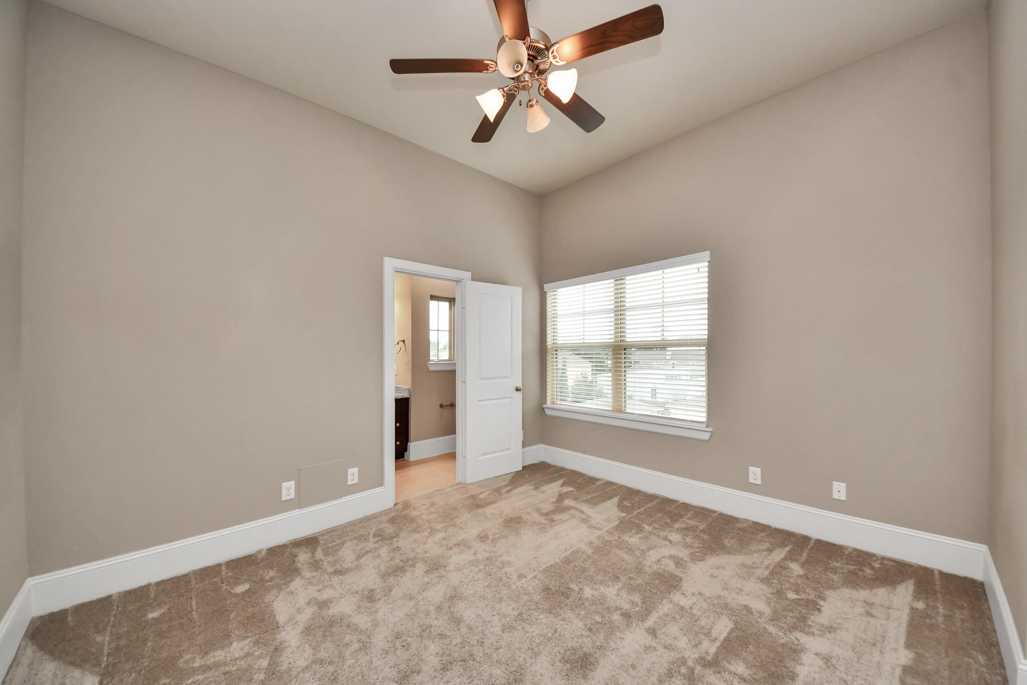 Another view of the 3rd floor guest bedroom with high ceilings.