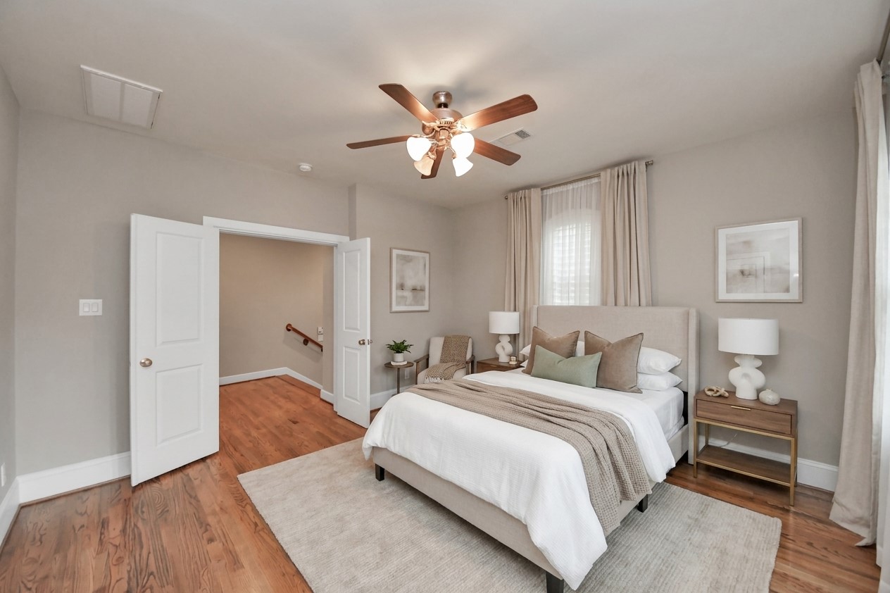 Virtually staged - downstairs full bedroom with ensuite bathroom and walk-in closet.  Leads to the backyard.
