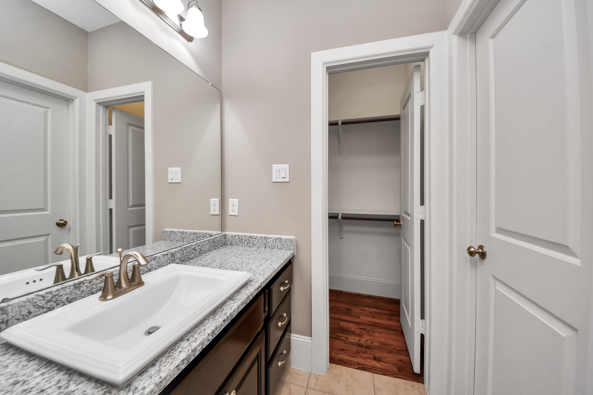 Another view of the downstairs bathroom with walk-in closet.