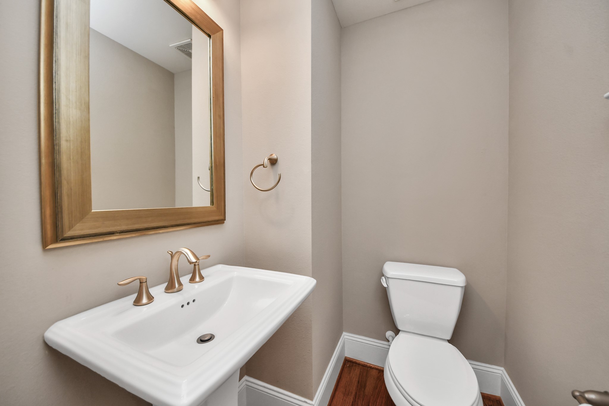 2nd floor half bath conveniently tucked around the corner from the main living area.