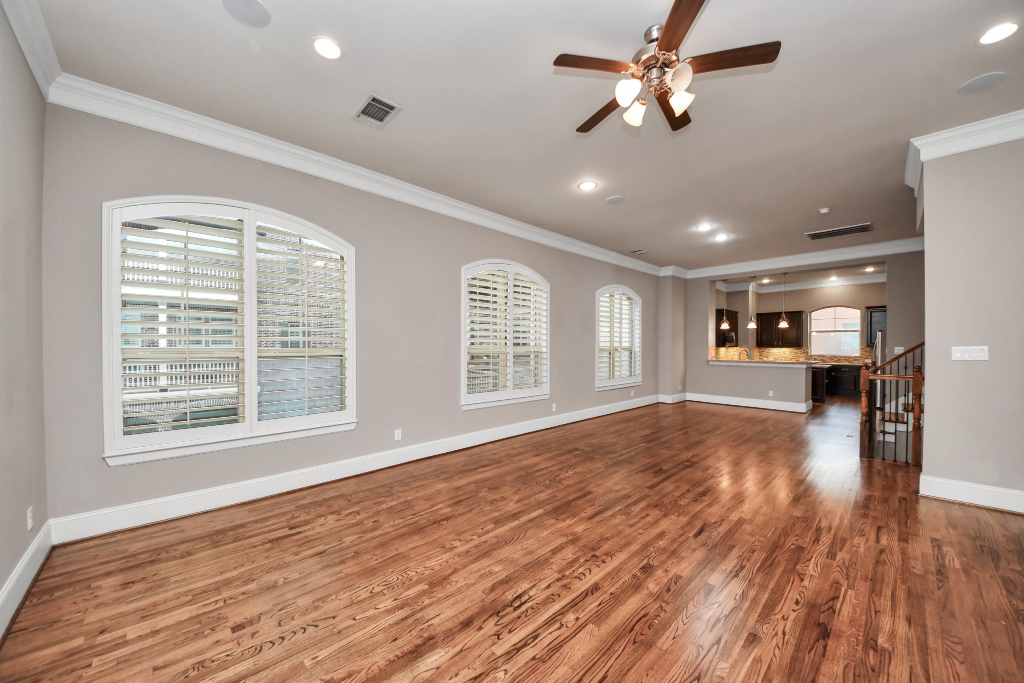 Another view of the dining area with hardwood floors that connect the kitchen to the living room, perfect for entertaining.