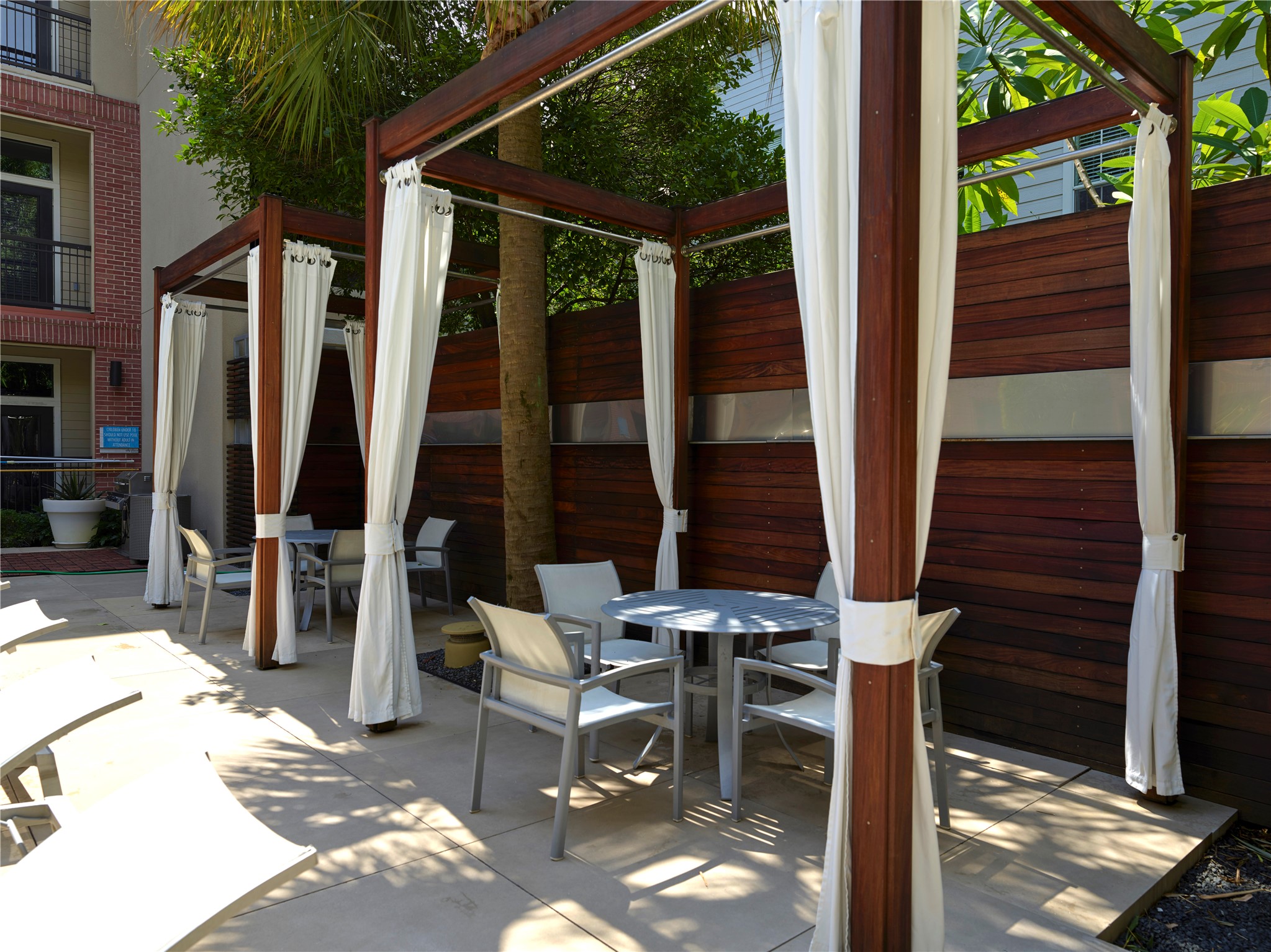 Pool cabana's, another area with gas grill and seating.