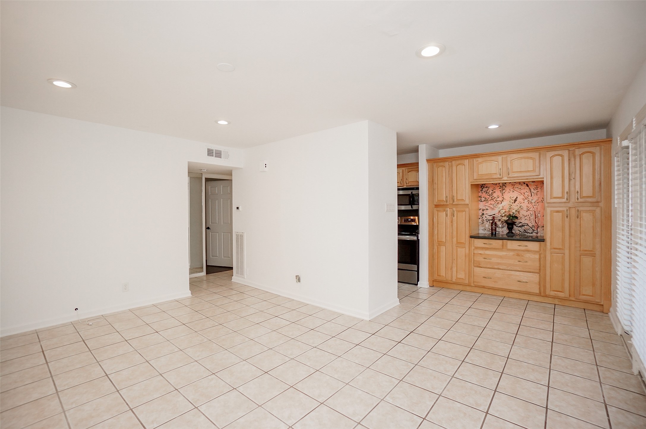View of the family room/living area and dining and a glimpse of the kitchen and hallway to the bedroom. View of the family room/living area and dining and a glimpse of the kitchen and hallway to the bedroom.