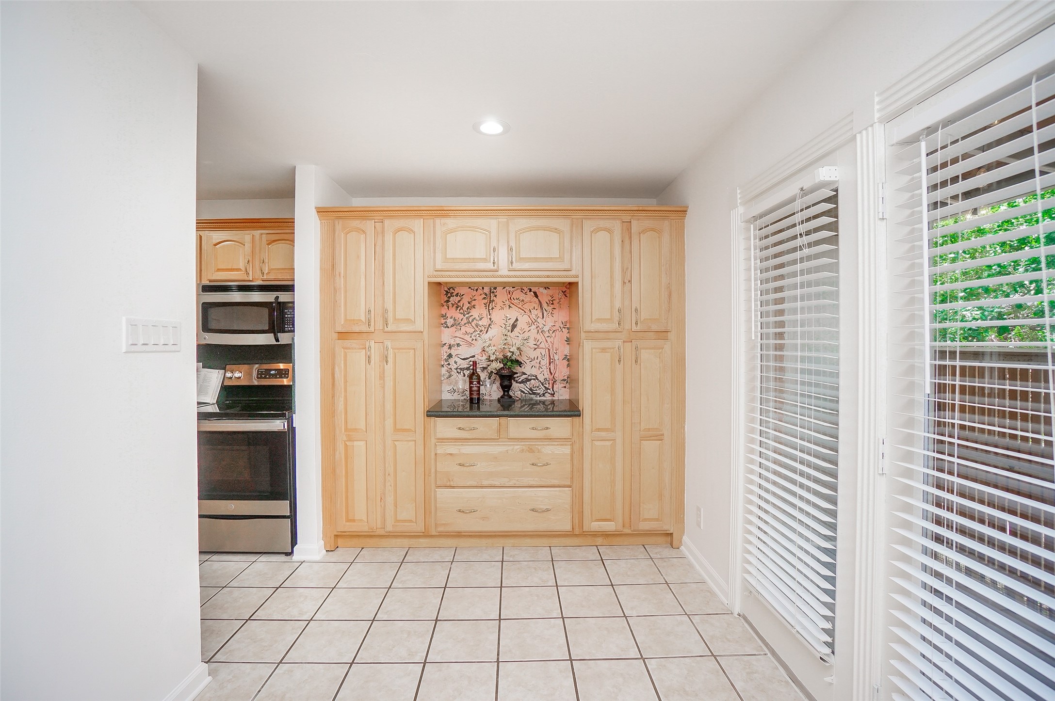 Glimpse of kitchen that opens to the dining area. Light and bright and ready for your furniture. Glimpse of kitchen that opens to the dining area. Light and bright and ready for your furniture.