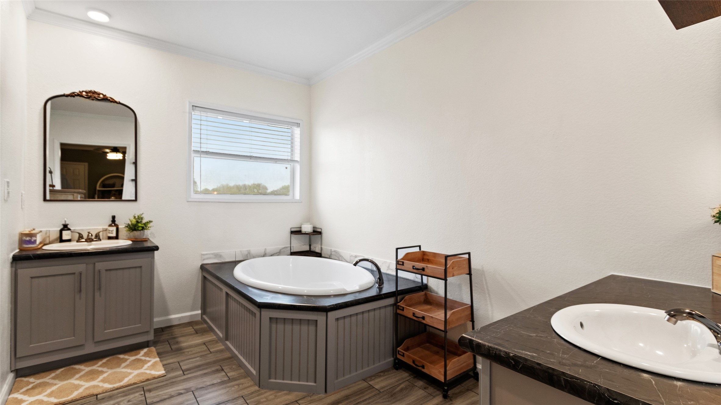 Primary en-suite with double vanities and soaking tub