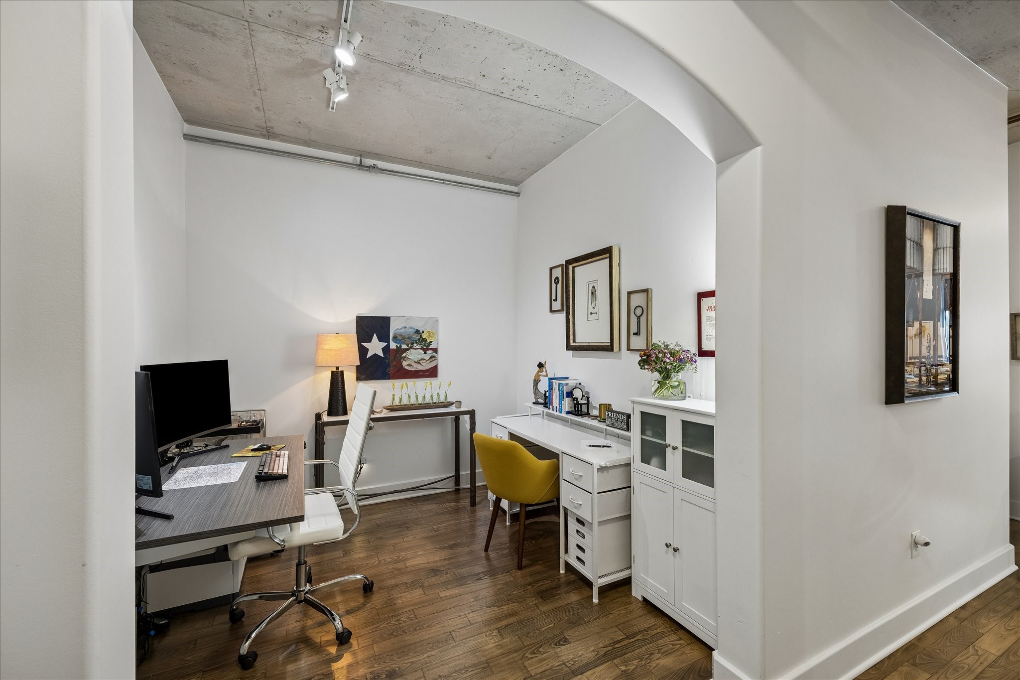 Chic and functional home office with plenty of workspace for productivity.