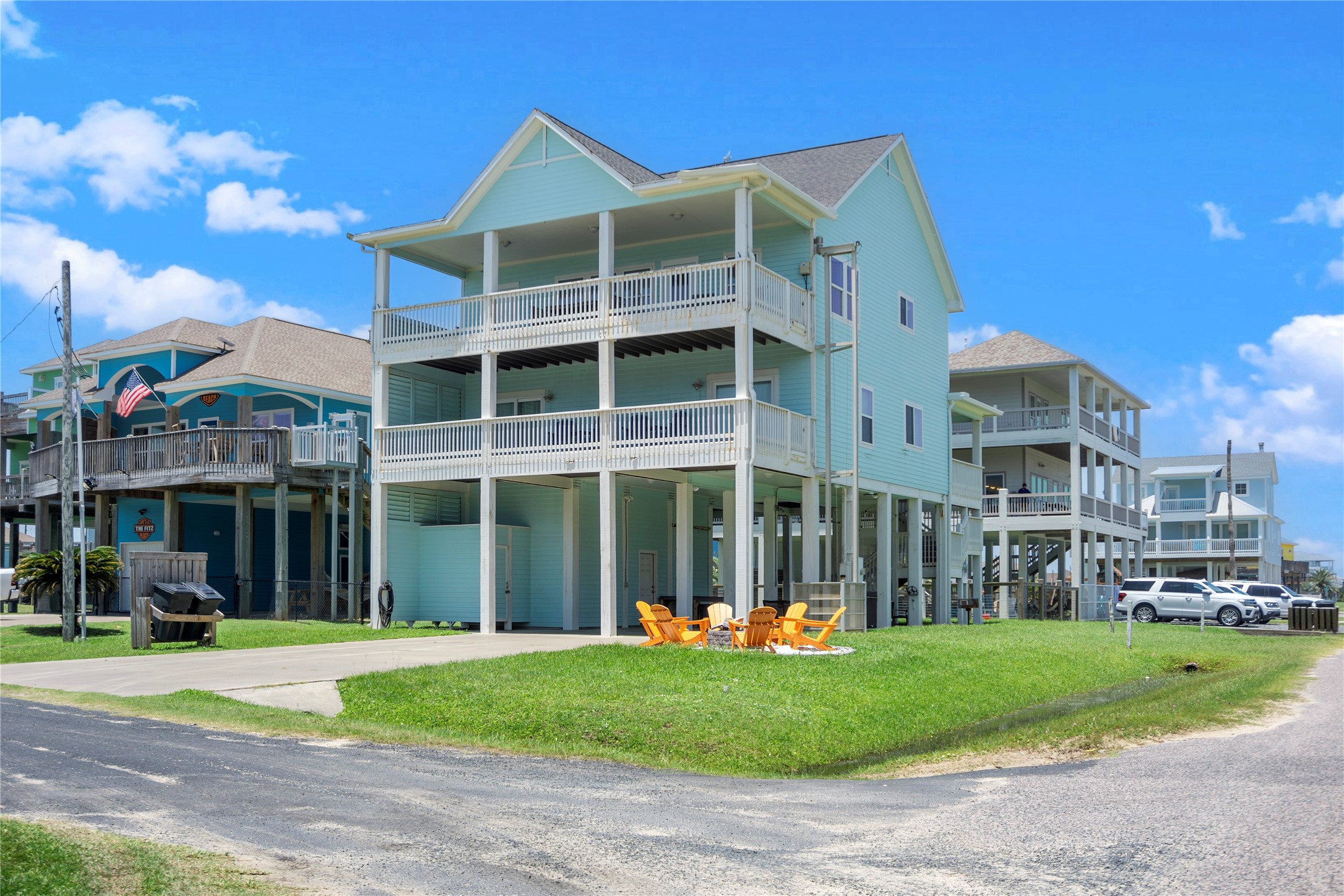 Coastal living feels right at home in this elevated retreat, complete with stacked covered balconies and generous outdoor space. Coastal living feels right at home in this elevated retreat, complete with stacked covered balconies and generous outdoor space.