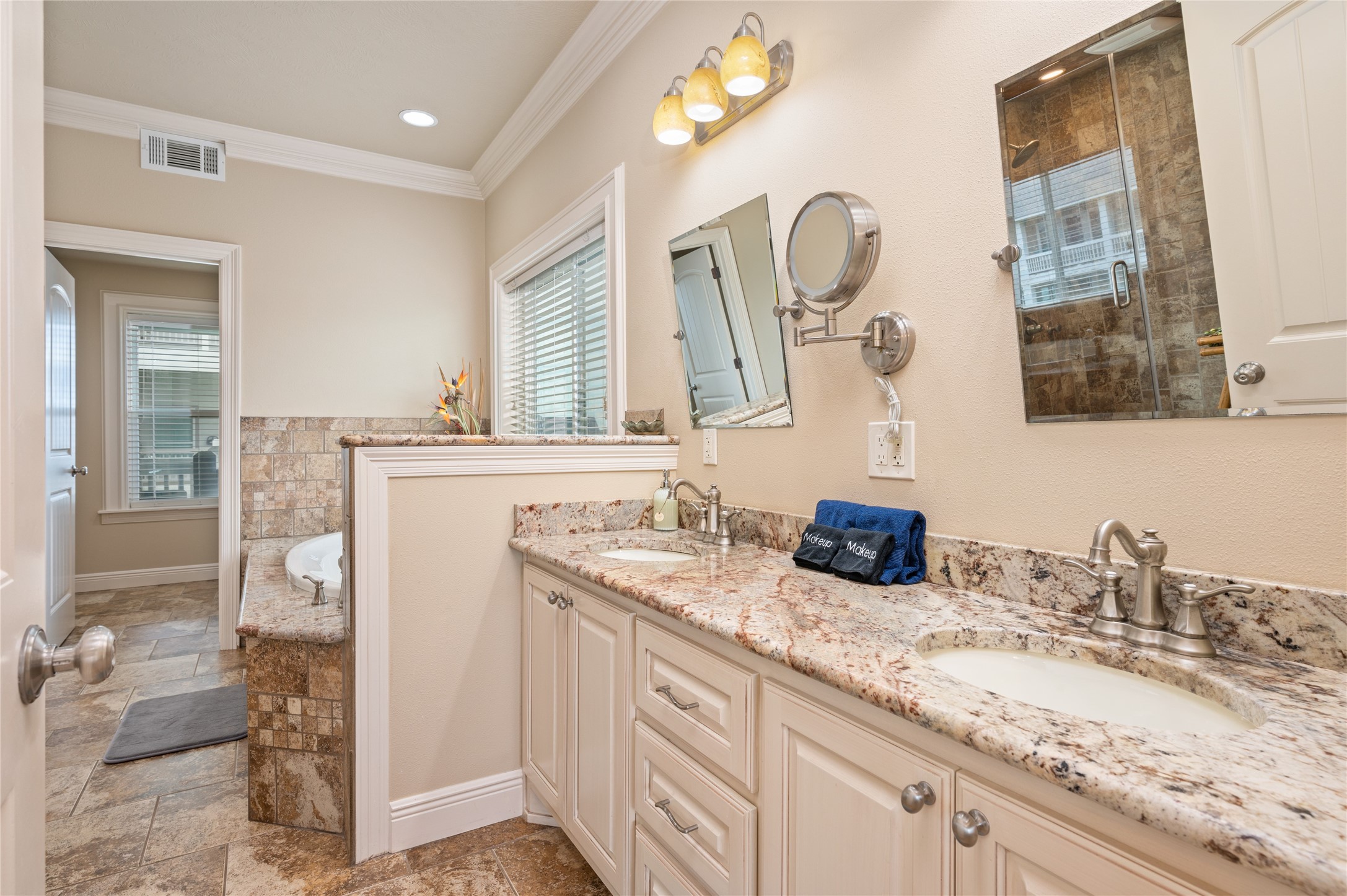 Primary suiteStart your morning with plenty of room to get ready at the dual-sink granite vanity, with a relaxing soaking tub just beyond.