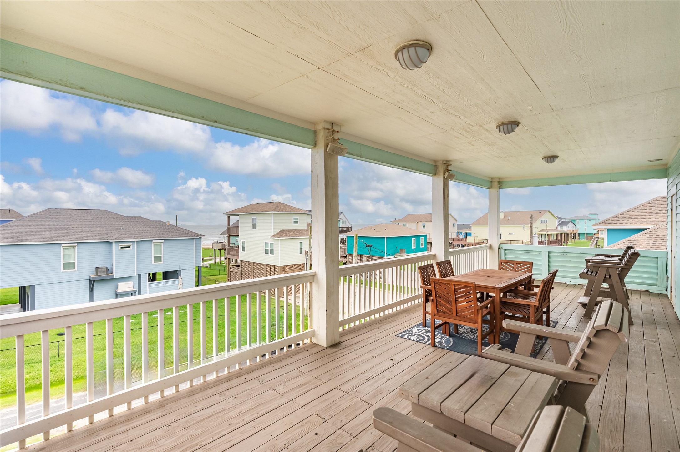 Theres room for everyone to spread out on this oversized balcony, whether youre gathering around the table or relaxing with the Gulf in sight.