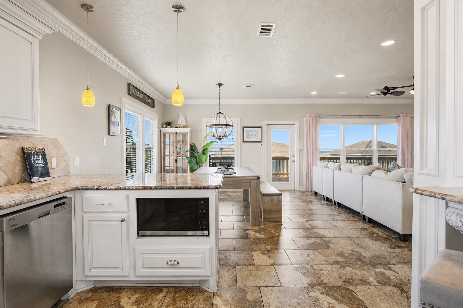 From the kitchen, everything stays connectedfrom meals at the table to relaxing in the living room and stepping outside onto the balcony.