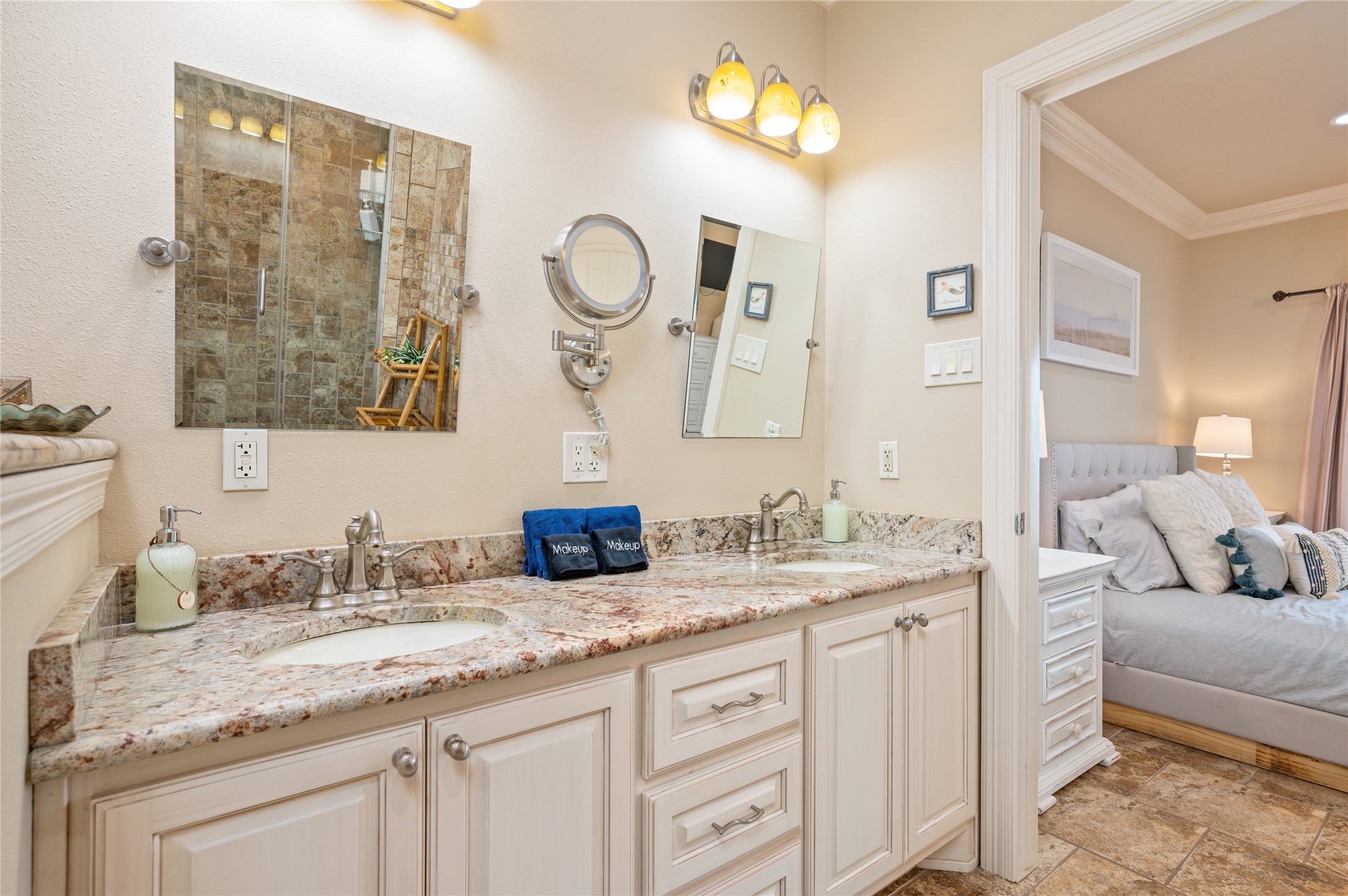 Getting ready is easy with your expansive dual-sink granite vanity, offering plenty of counter space and storage for two.