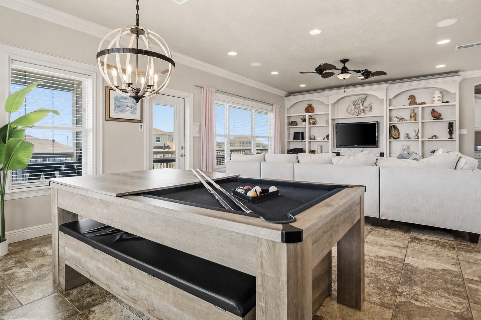 Flip the dining table into a pool table whenever the competition starts, all while staying connected to the living room and balcony.