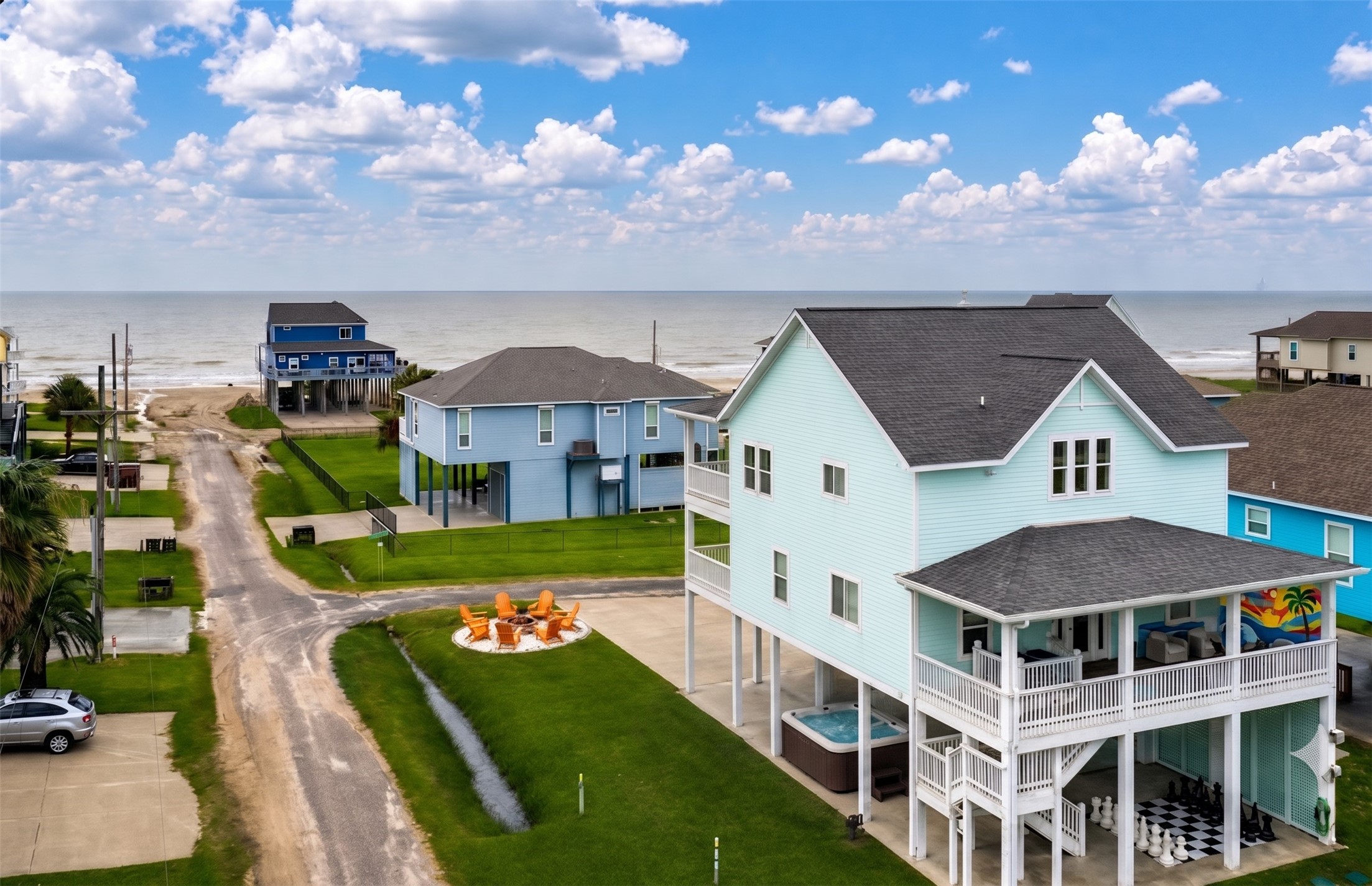 This house is ready for fun! When you're back from the beach, enjoy the newly added firepit, hot tub, life-sized chess board, and mural on the shaded deck.