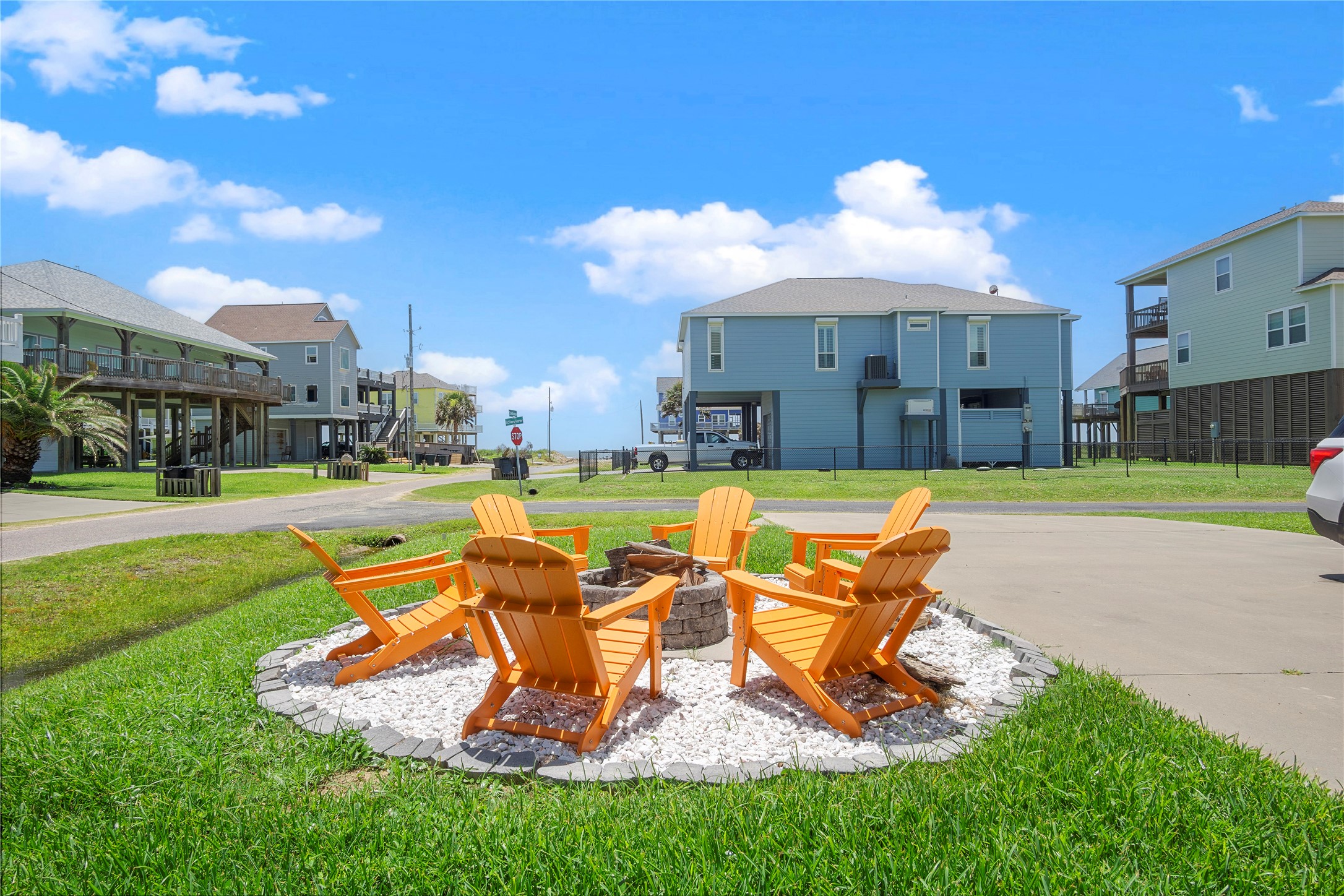 Evenings at home are made for gathering around the firepit, with plenty of Adirondack seating for everyone. Evenings at home are made for gathering around the firepit, with plenty of Adirondack seating for everyone.