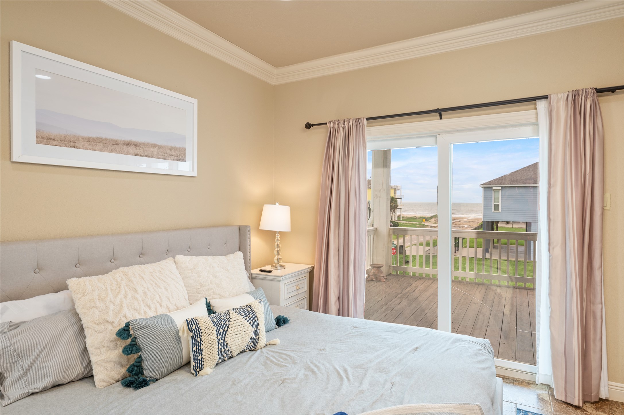 Wake up to coastal views right from your primary bedroom, then step through the sliding doors onto your private covered deck.