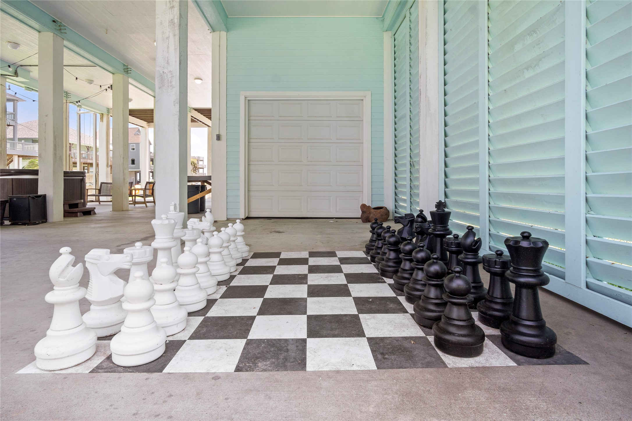 Game time gets a larger-than-life upgrade with your oversized outdoor chess set tucked beneath the home. Game time gets a larger-than-life upgrade with your oversized outdoor chess set tucked beneath the home.