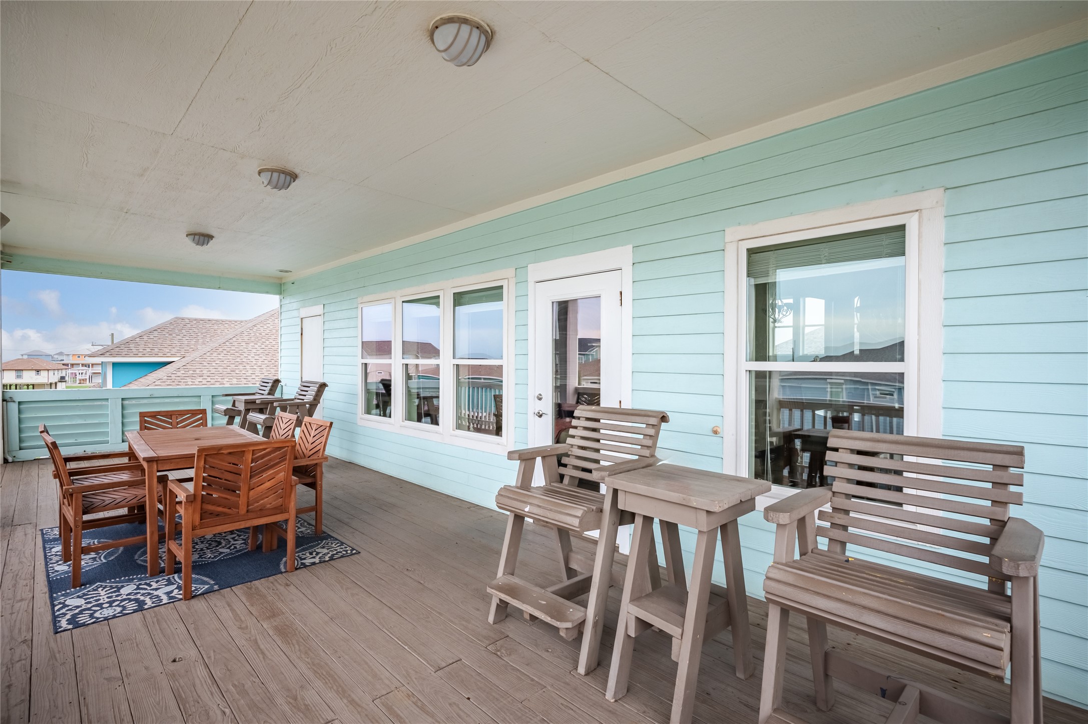 Step right outside from the living area to your expansive covered balcony, already set up for meals and laid-back afternoons outdoors