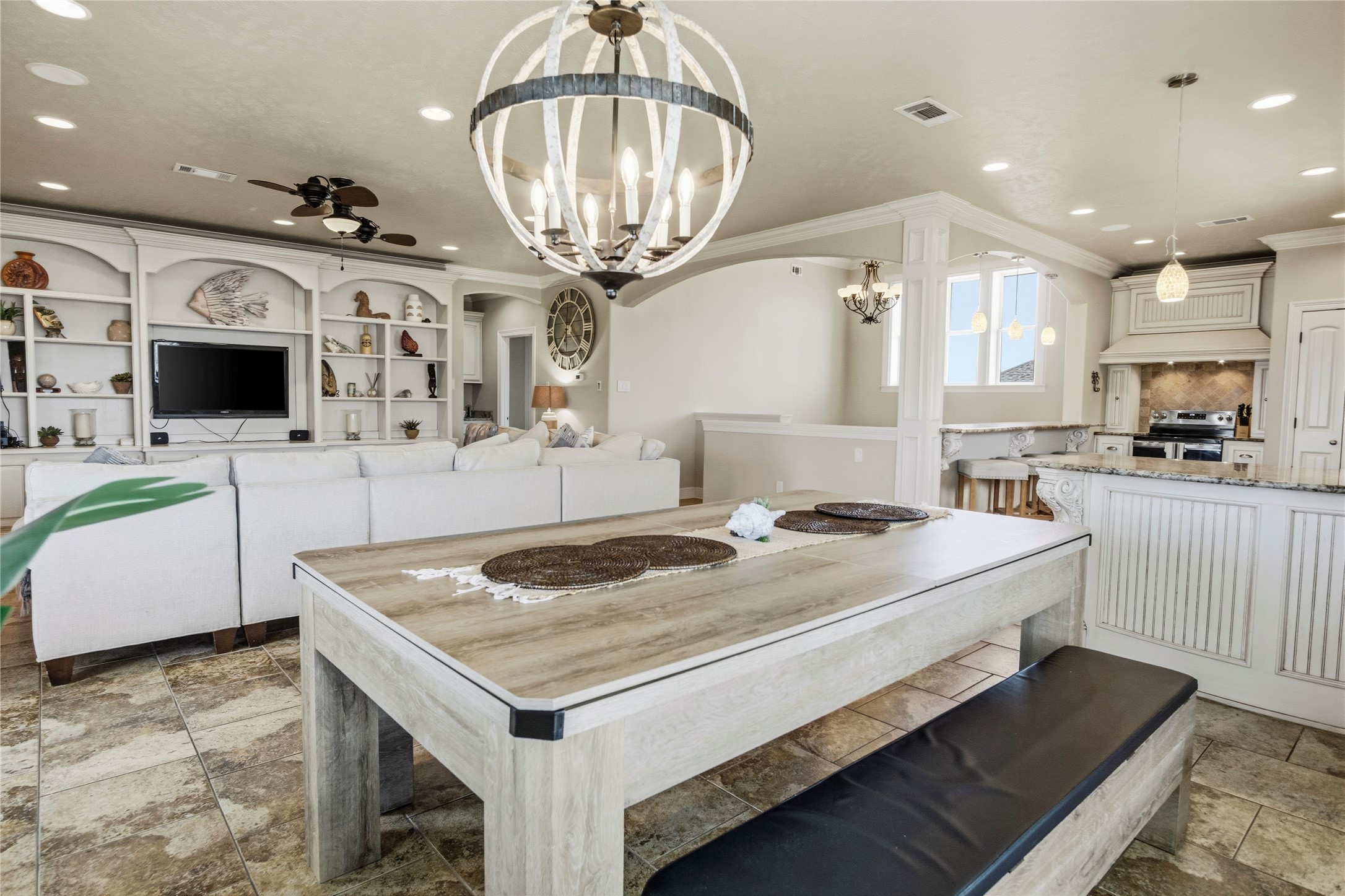 Dinner, game nights, and downtime all come together in this open living space, with the convertible pool table keeping entertainment close at hand.
